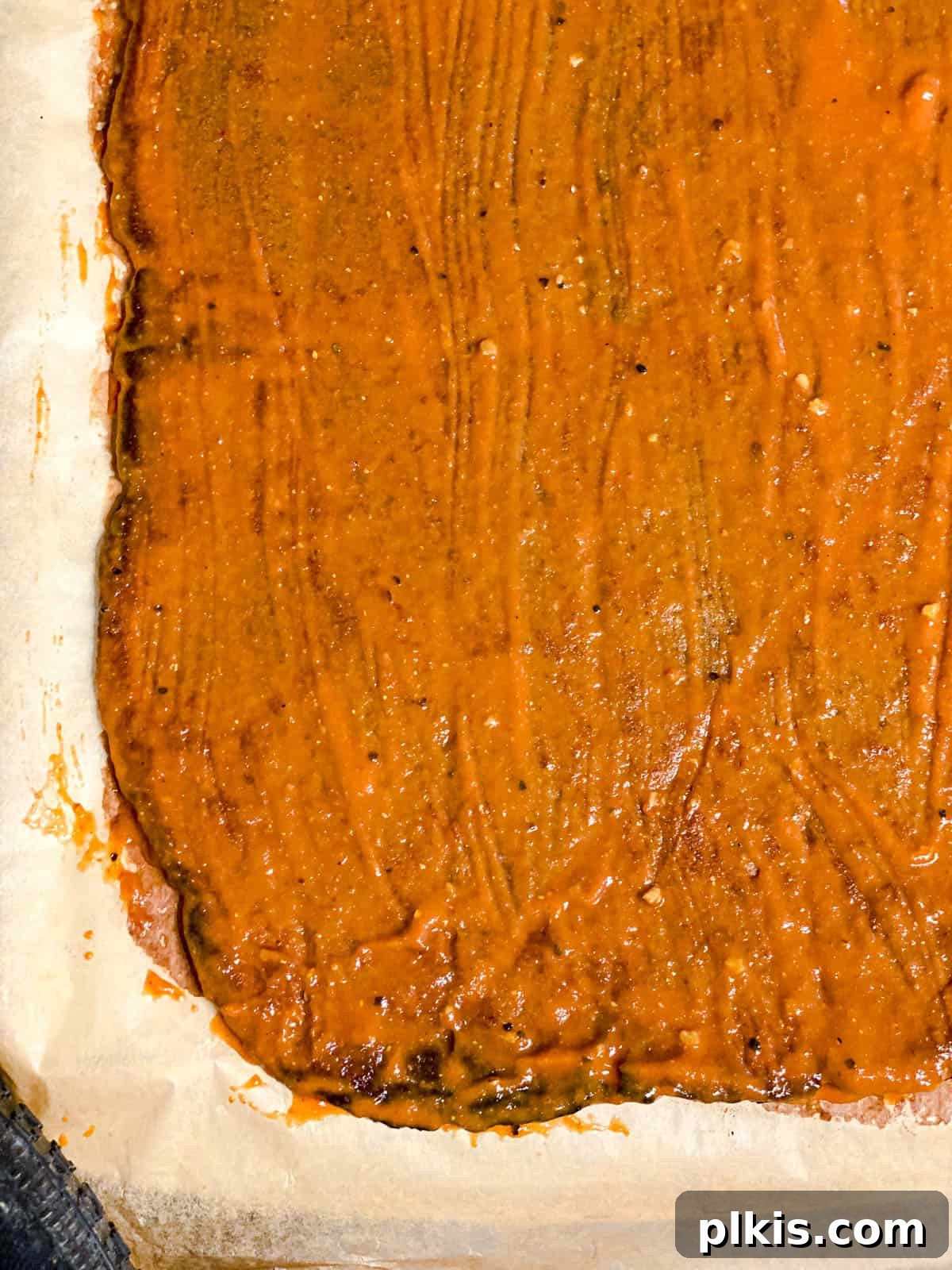 Umami Mushroom Bites 8 Process shot showing mushroom jerky with sauce on it