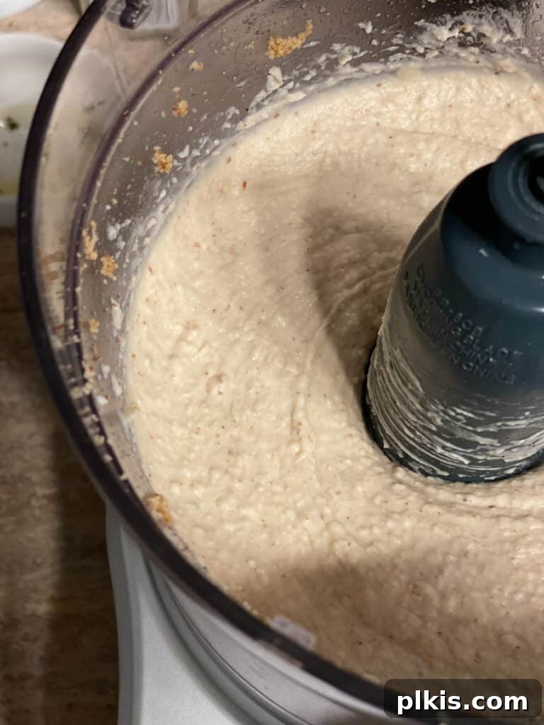 Plant-Powered Bean Dip 12 process shot post blending bean mixture in food processor