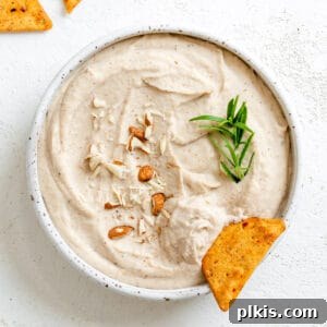 completed Vegan Bean Dip in a white bowl against a white background