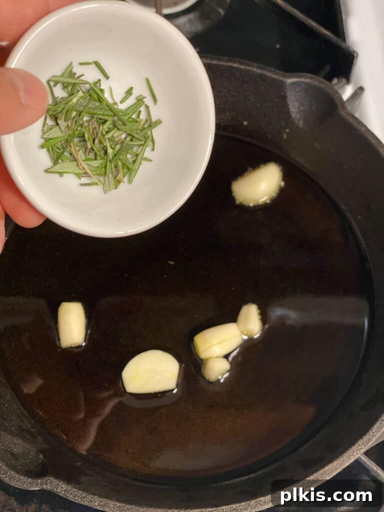 Plant-Powered Bean Dip 8 process shot of adding rosemary to pan