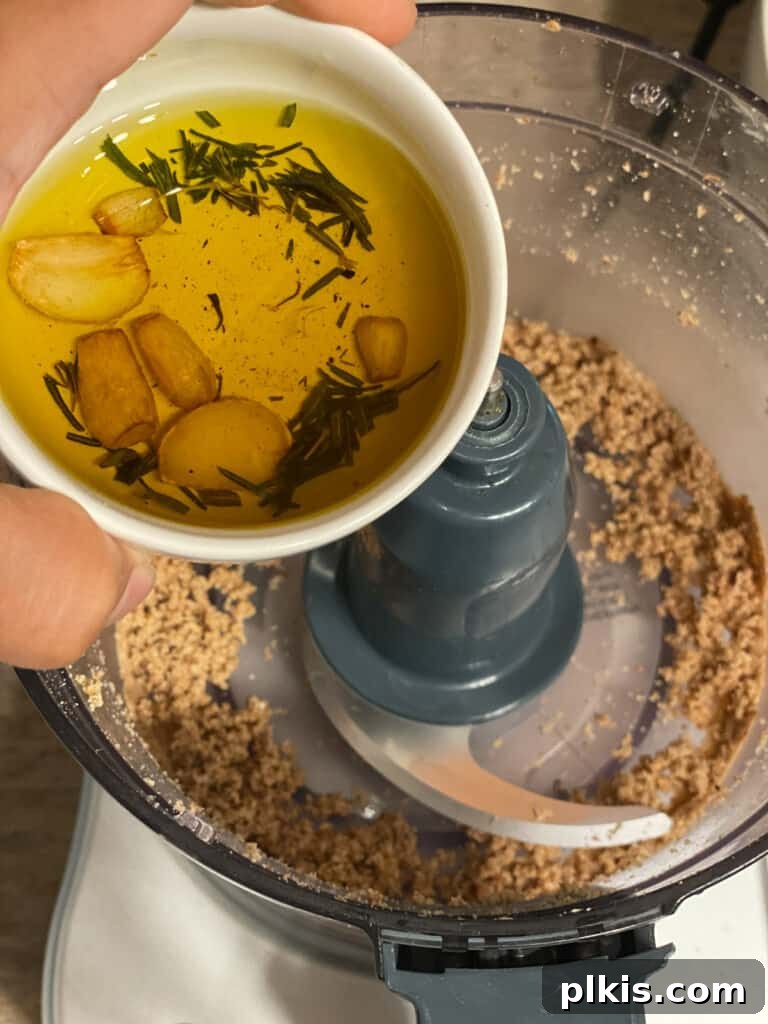 Plant-Powered Bean Dip 10 process shot of adding mixture to food processor