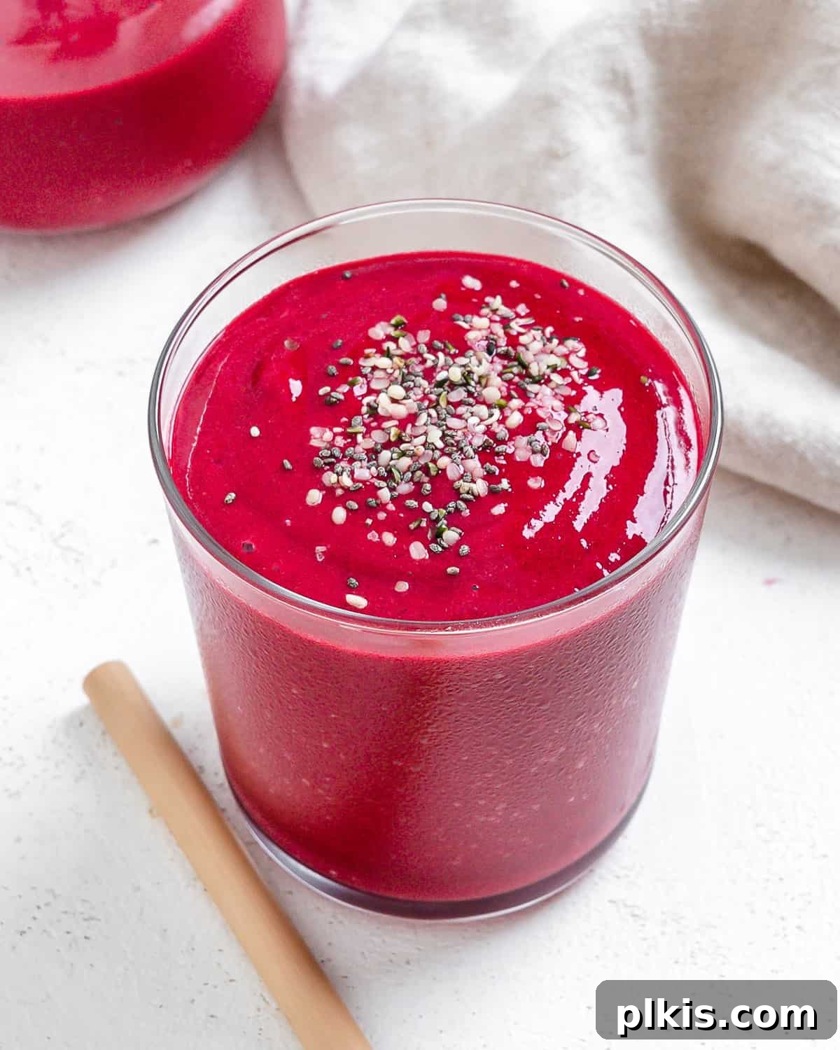 Ruby Red Beet & Banana Bliss 6 A vibrant Banana Beet Smoothie in a glass cup, perfectly blended and ready to drink, against a soft, light background.