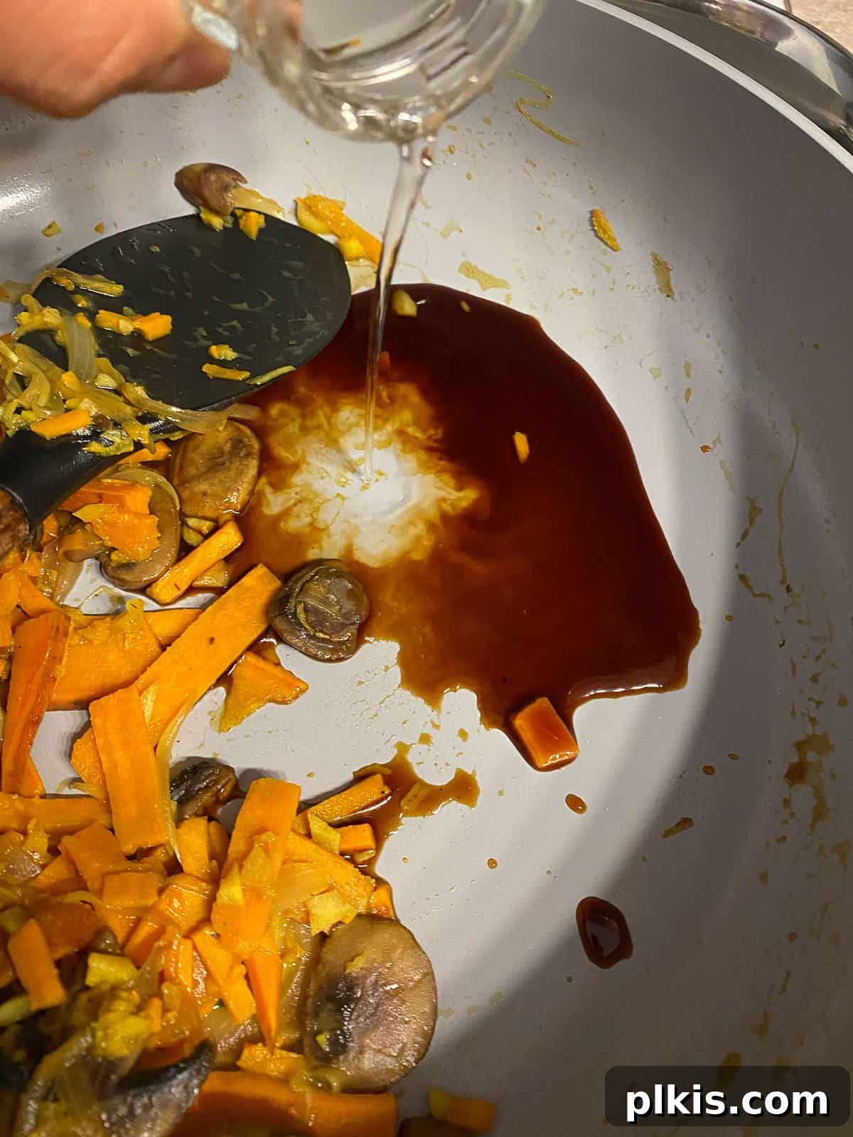 Nourishing Sweet Potato Fried Rice 11 A splash of vinegar being added to the sweet potato mixture.