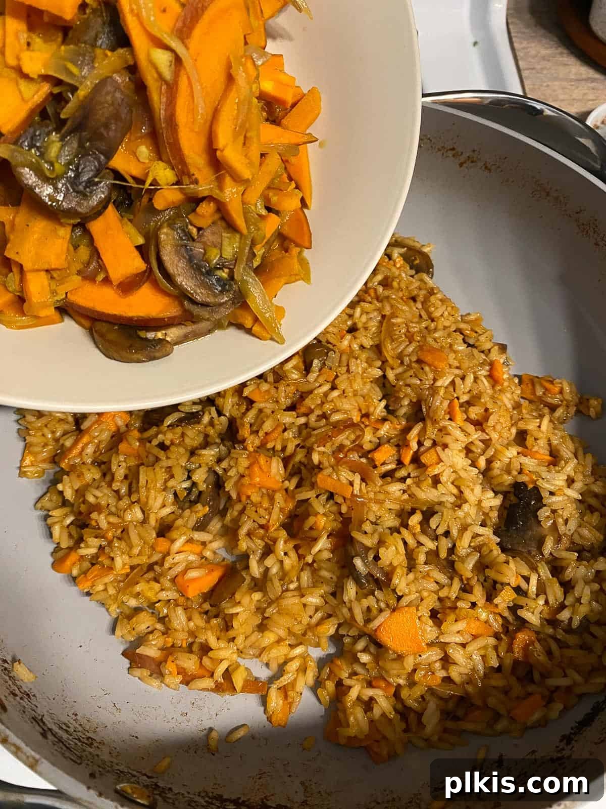 Nourishing Sweet Potato Fried Rice 15 Remaining vegetables being returned to the pan with the rice.