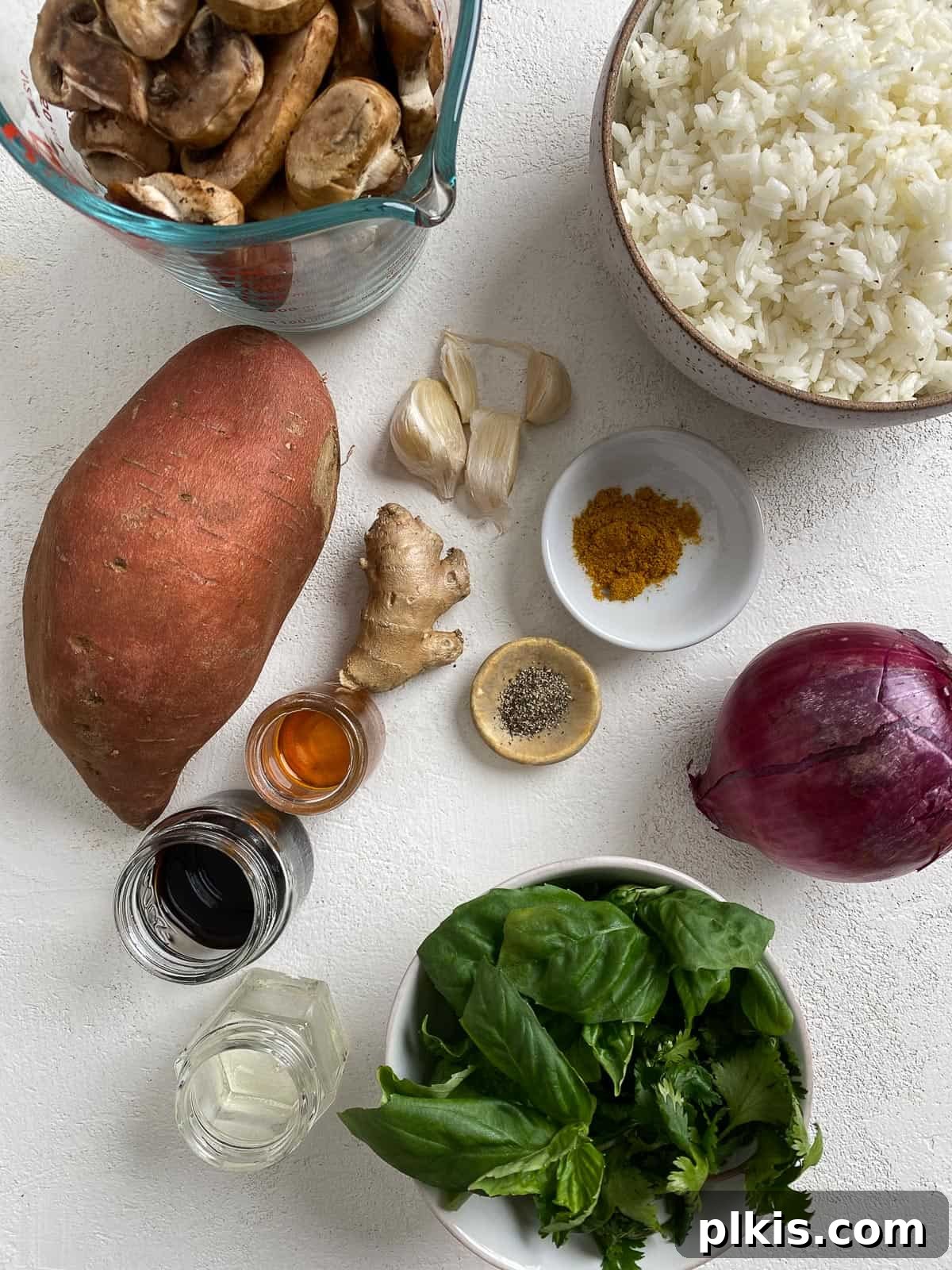 Nourishing Sweet Potato Fried Rice 3 Arrangement of fresh ingredients for Healthy Sweet Potato Fried Rice on a white background.