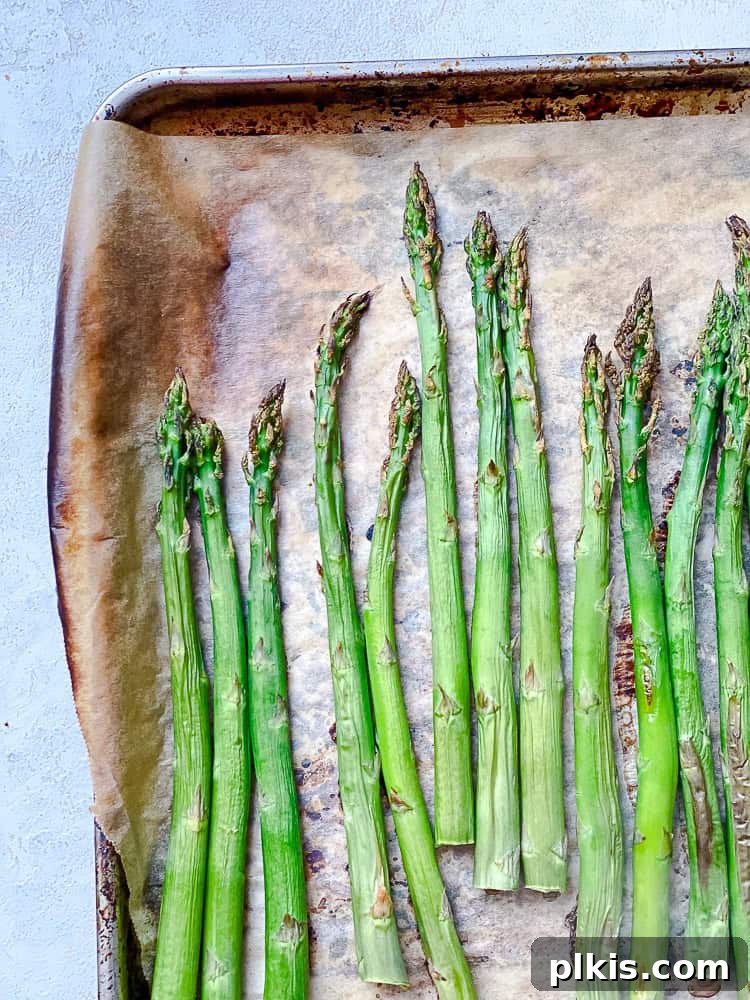 Process shot showing asparagus on surface.