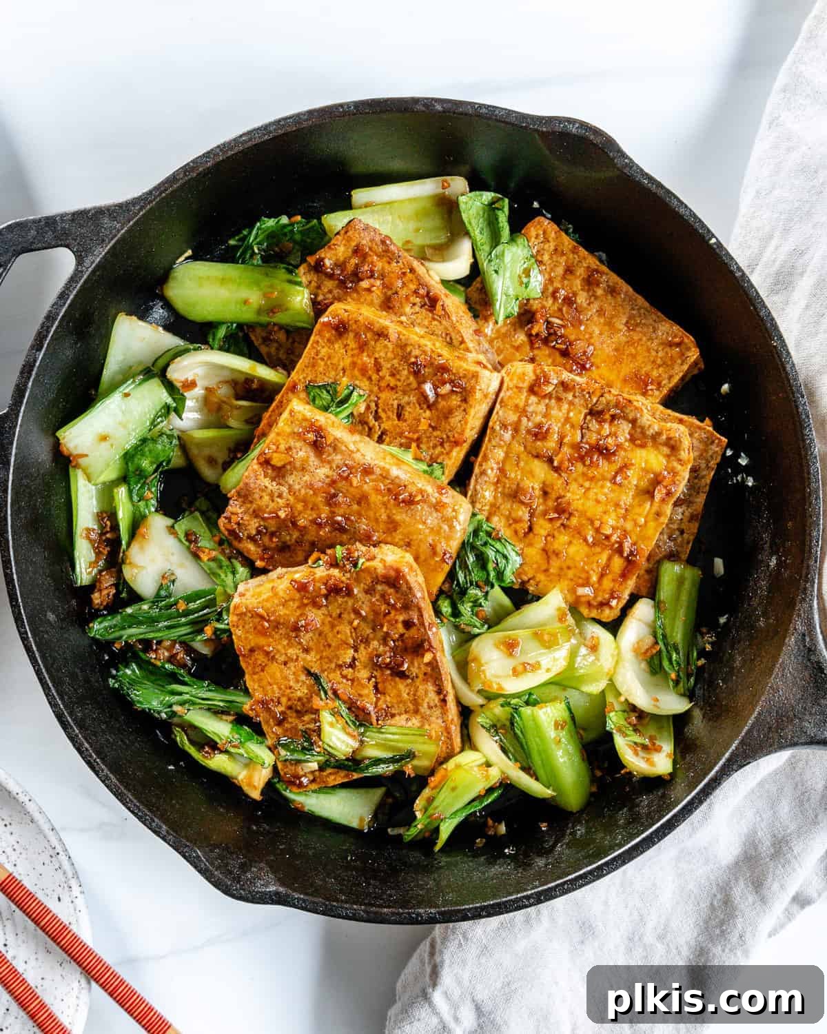 Sweet and Spicy Tofu Stir-Fry 2 Completed Spicy and Sweet Tofu in an iron skillet, ready to serve.