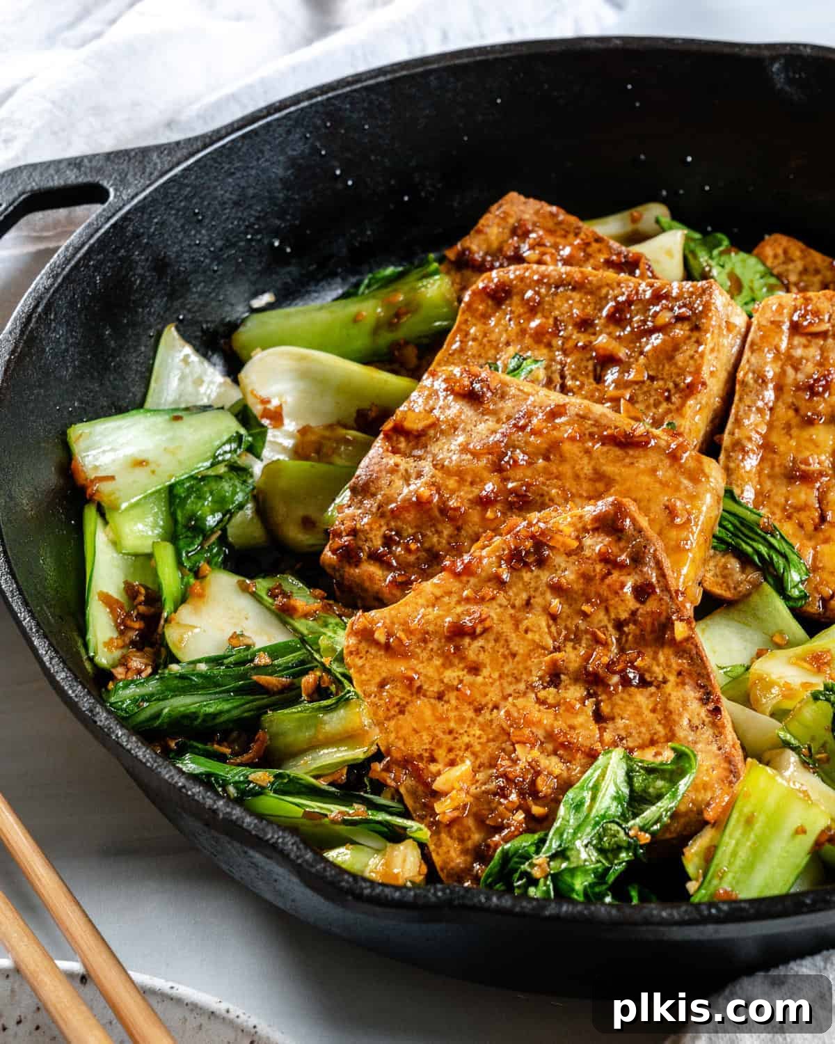 Sweet and Spicy Tofu Stir-Fry 11 Completed Spicy and Sweet Tofu in an iron skillet, presented beautifully.