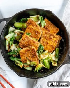 Sweet and Spicy Tofu Stir-Fry 9 Close-up of the completed Spicy and Sweet Tofu in an iron skillet, garnished and ready.