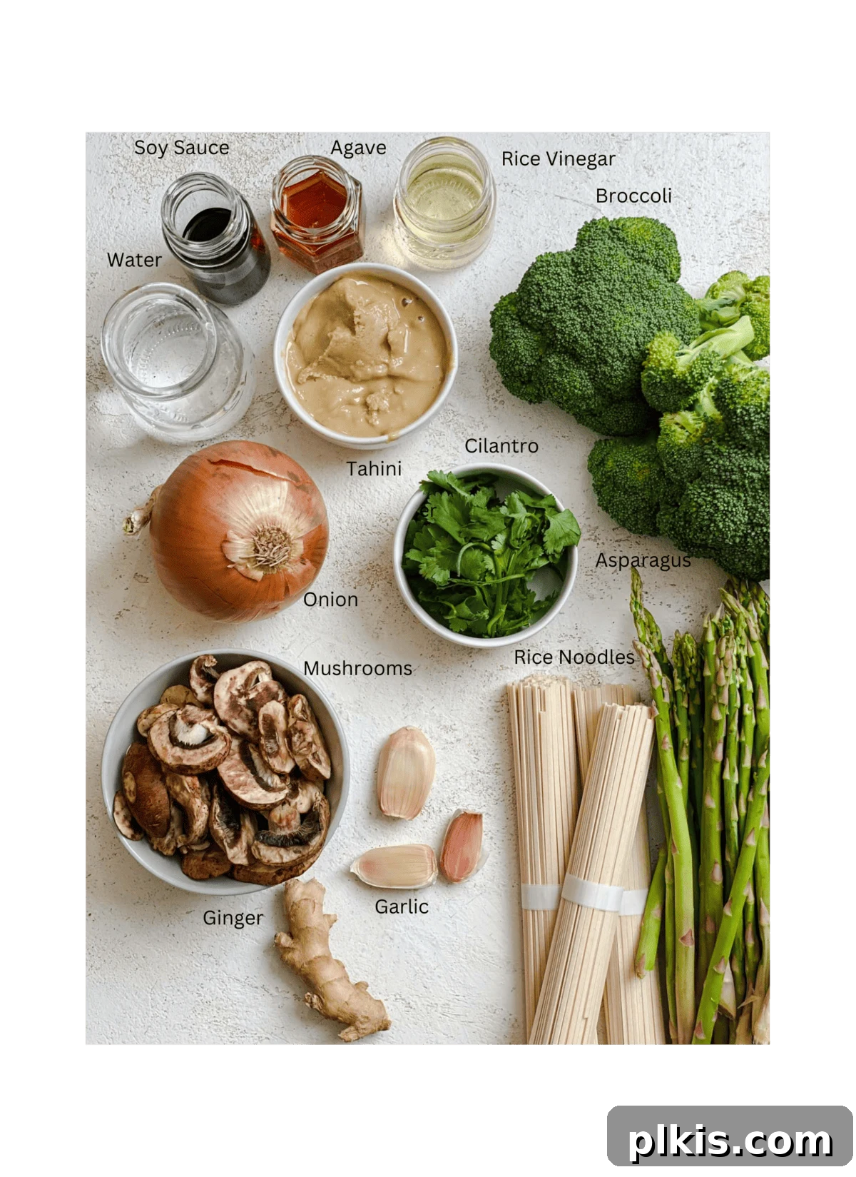 Velvet Rice Noodle Stir Fry 3 ingredients for Creamy Rice Noodle Stir Fry measured out against a white surface