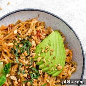 Completed Vegan Vegetable Pad Thai plated against a light background