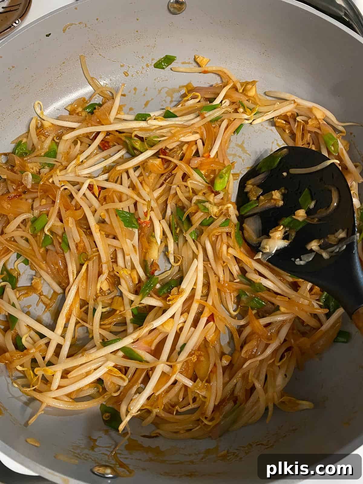 Process of mixing ingredients in the pan together with the sauce.