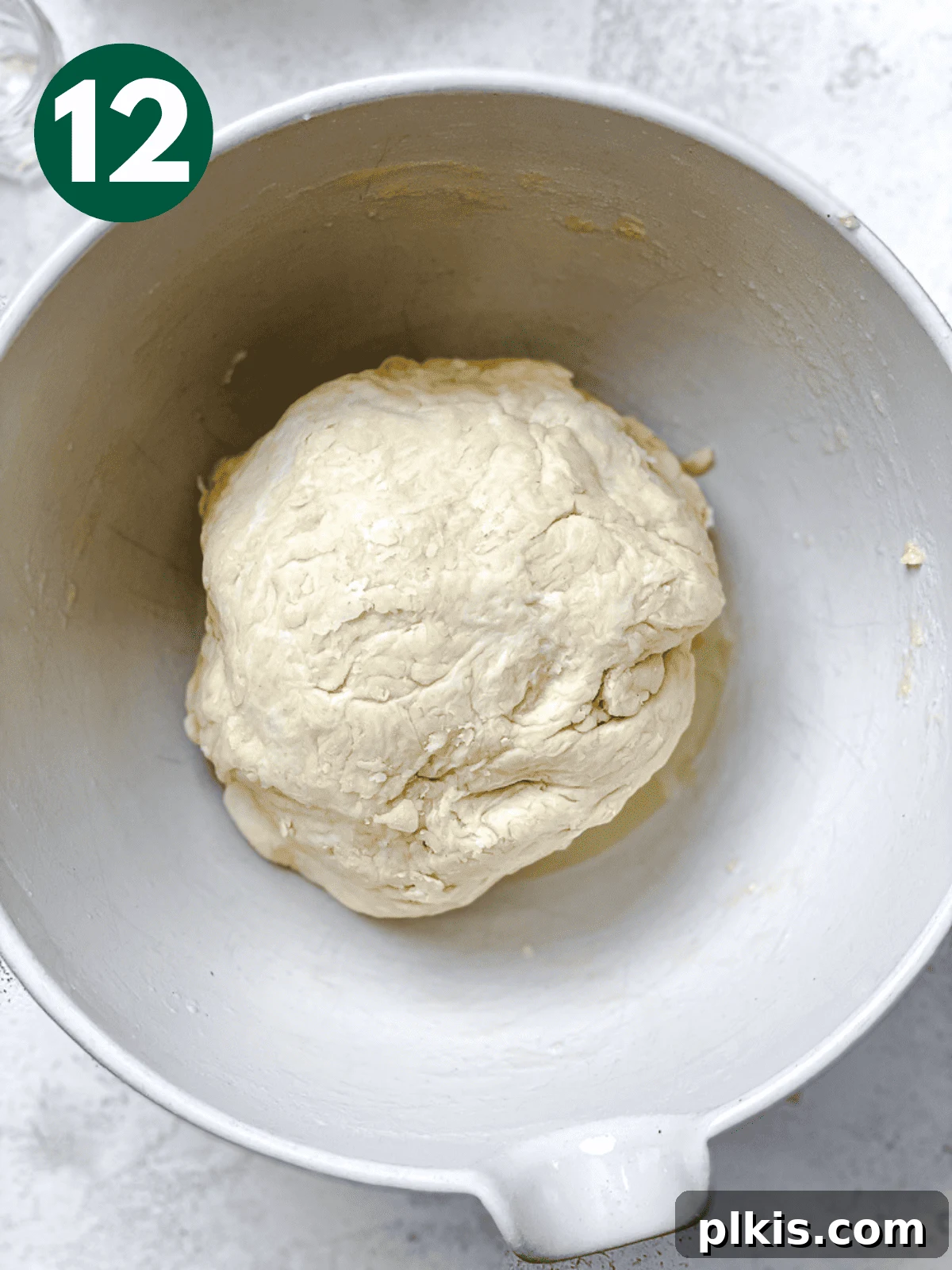Heavenly Vegan Cinnamon Rolls 15 A ball of dough placed into an oiled large white bowl, ready for its first rise.