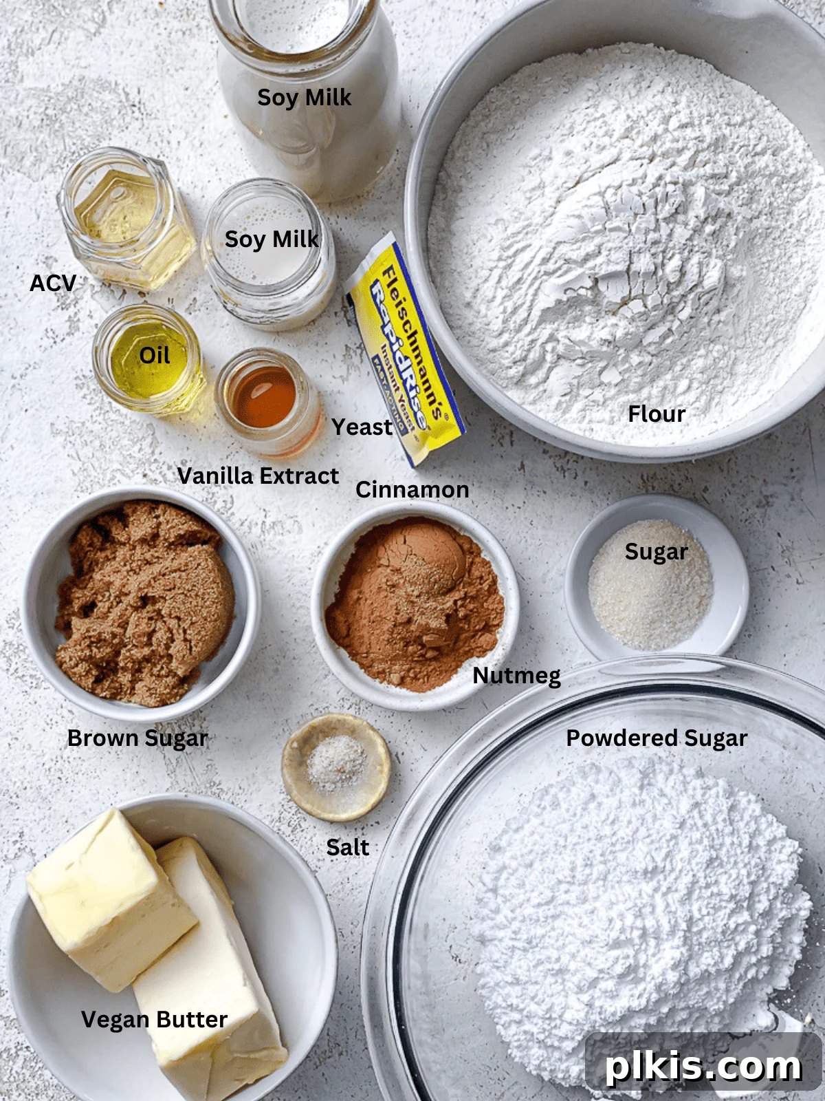 Heavenly Vegan Cinnamon Rolls 3 Ingredients for vegan cinnamon rolls laid out in individual bowls with clear labels.