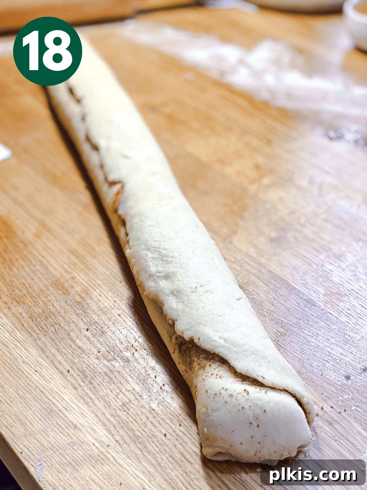 Heavenly Vegan Cinnamon Rolls 21 A fully rolled log of cinnamon roll dough, ready for slicing.