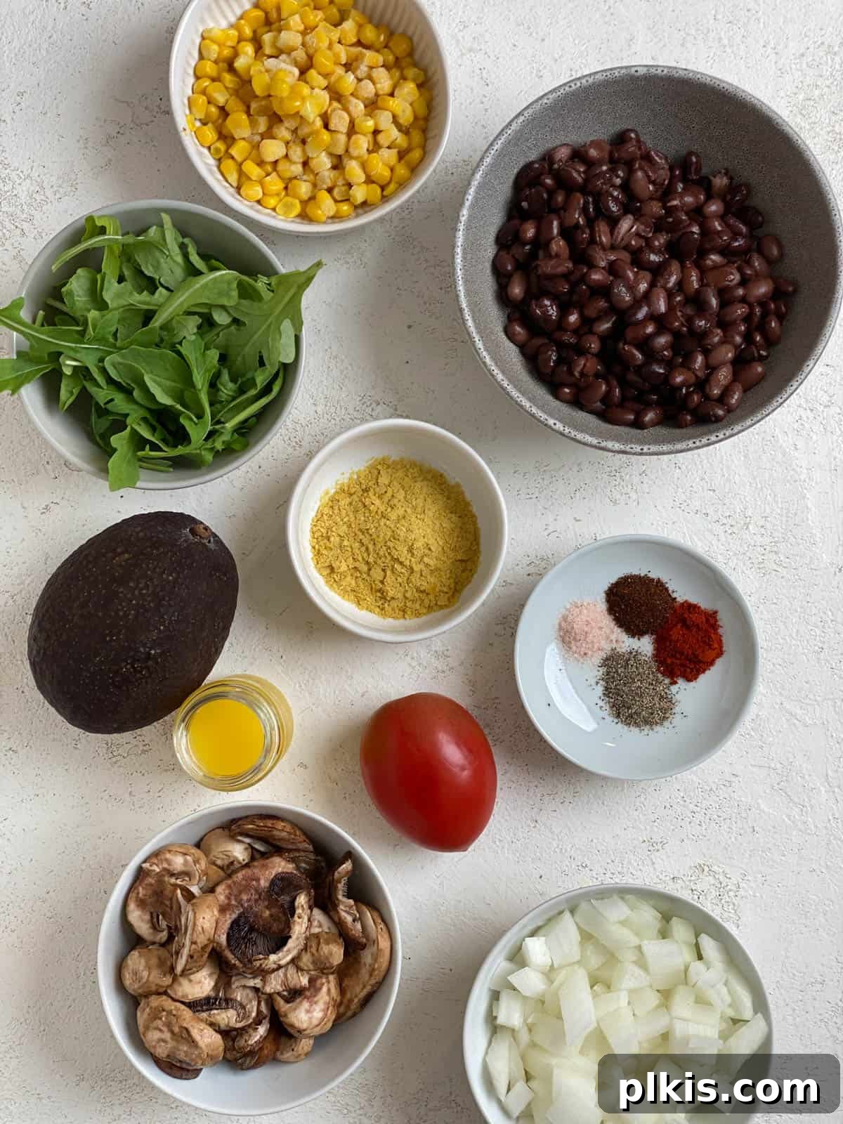 ingredients for Vegan Black Bean Tacos [2 Ways] measured out against a white surface