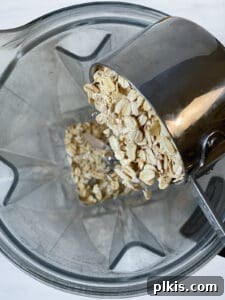 process of adding oatmeal to food processor