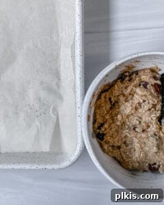 process of adding Chocolate Chip Banana Bites dough onto parchment paper