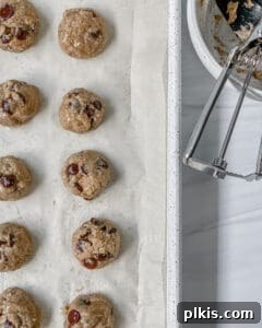 process of adding Chocolate Chip Banana Bites dough onto parchment paper