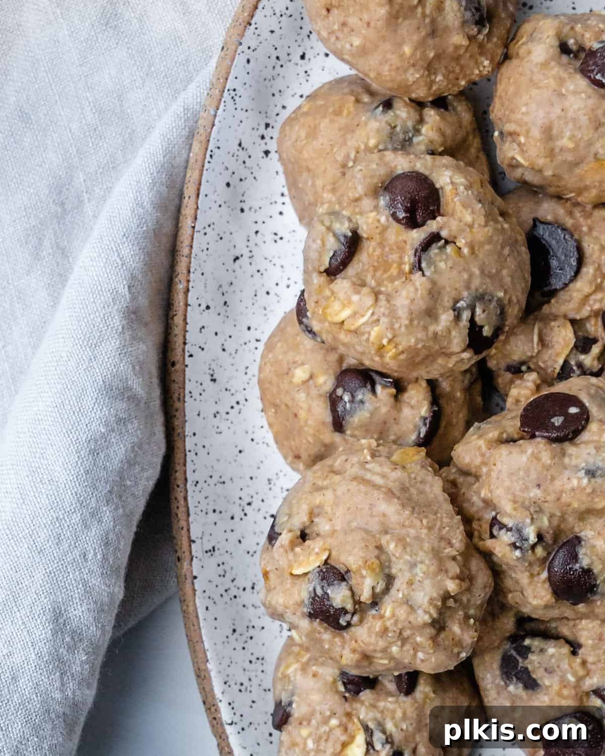completed Chocolate Chip Banana Bites stacked on each other on a white plate