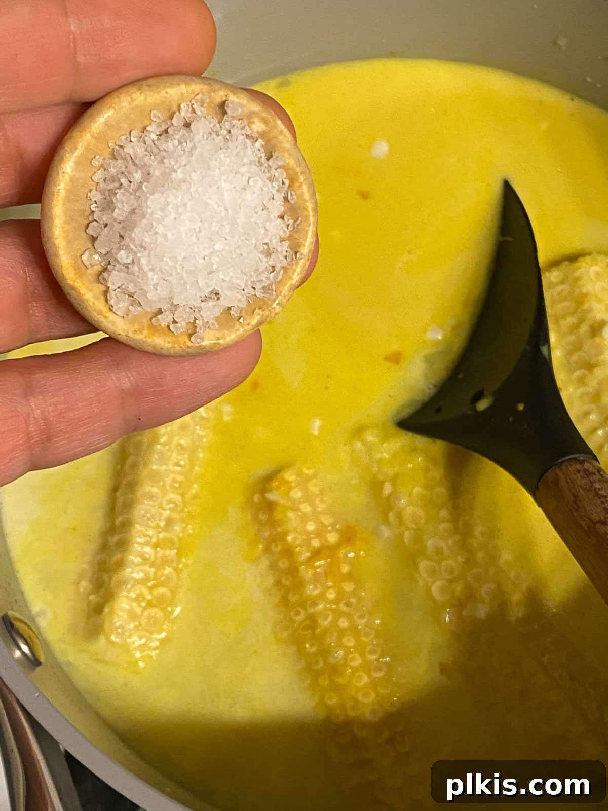Velvety Vegan Coconut Corn Chowder 13 Step 2: Seasoning the chowder with sugar and salt.