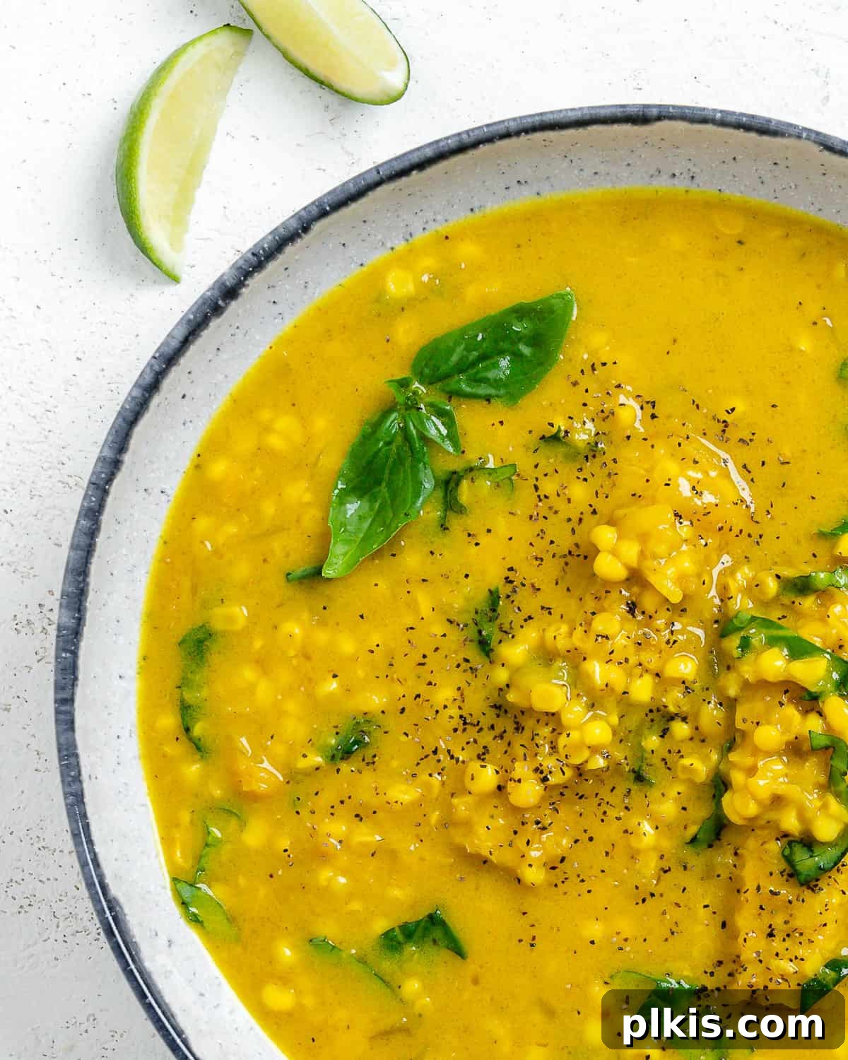 Velvety Vegan Coconut Corn Chowder 17 A beautifully presented bowl of creamy vegan corn chowder with coconut milk, ready to be enjoyed as a comforting meal.