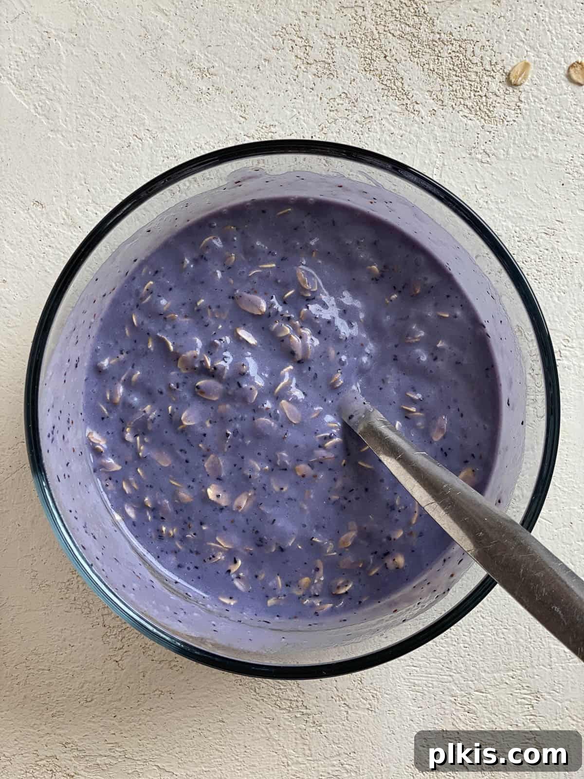 Overnight Blueberry Delight 15 Shaking the jar to mix the blueberry liquid and oats thoroughly.