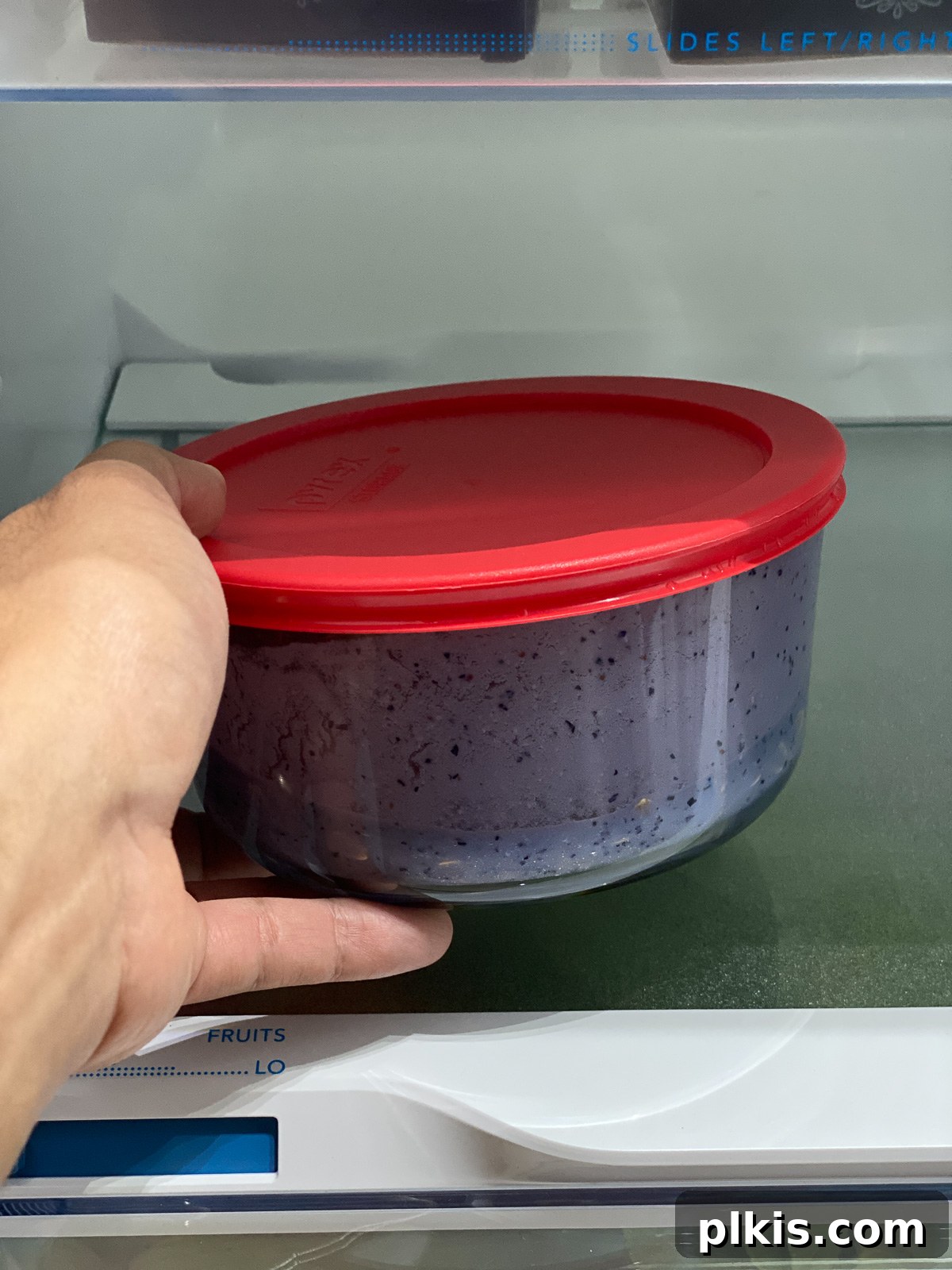 Overnight Blueberry Delight 16 Placing the jar of blueberry overnight oats into the refrigerator for soaking.