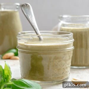Vibrant Basil Vinaigrette 8 Completed Basil Salad Dressing in two jars.