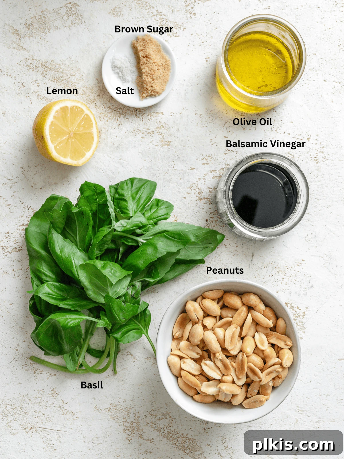 Vibrant Basil Vinaigrette 3 Ingredients for Basil Salad Dressing measured out on a white surface.