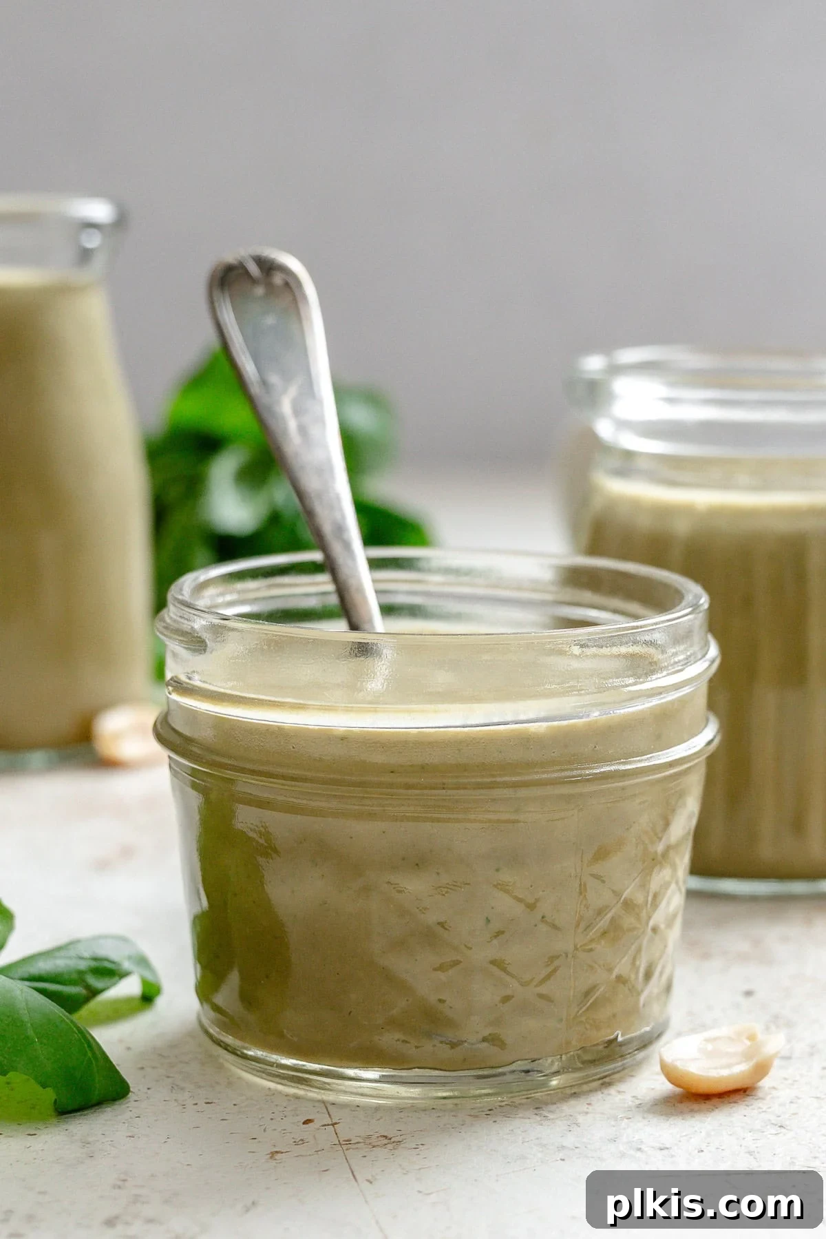 Vibrant Basil Vinaigrette 6 Completed Basil Salad Dressing in two jars.