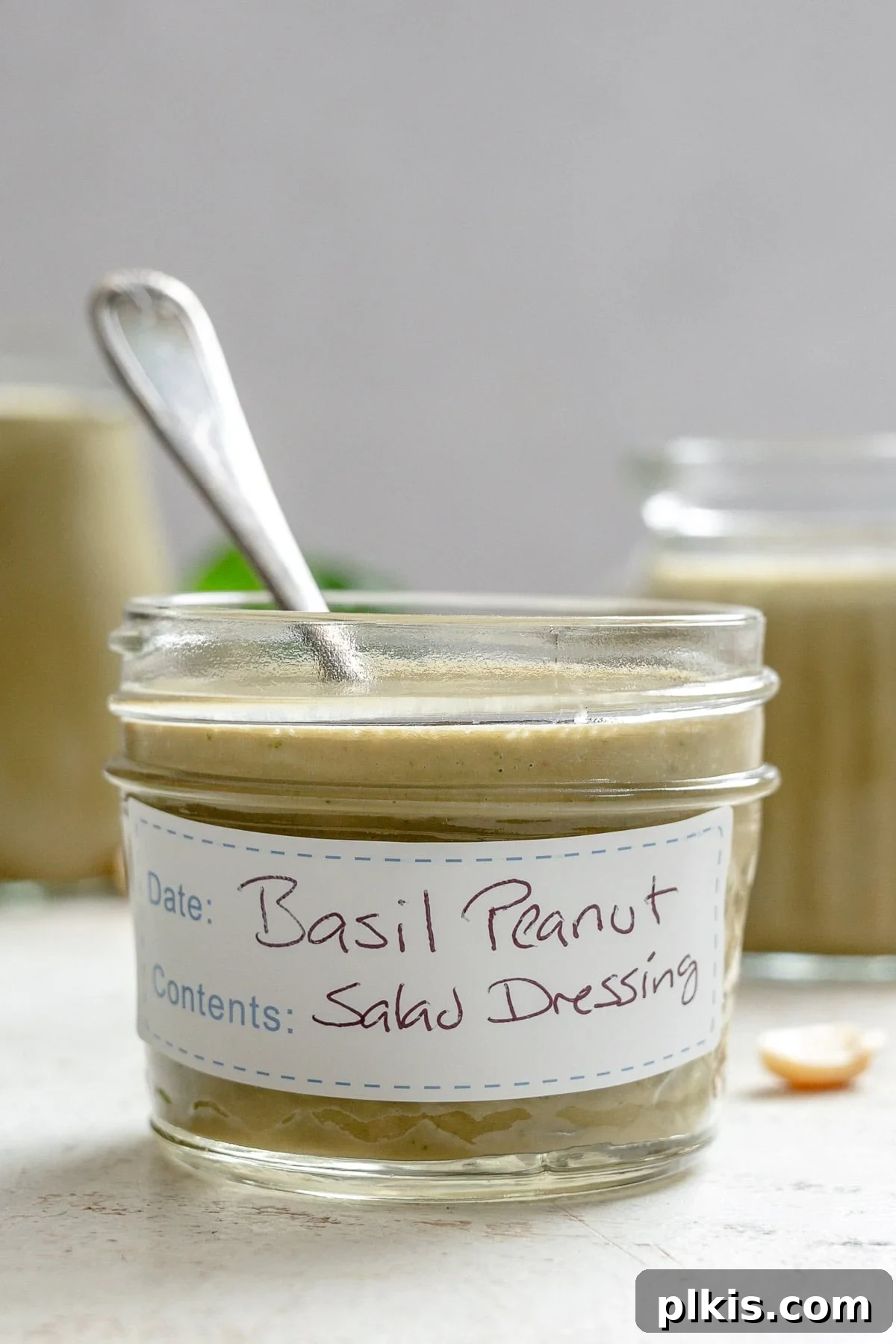 Vibrant Basil Vinaigrette 7 Completed Basil Salad Dressing in a jar.