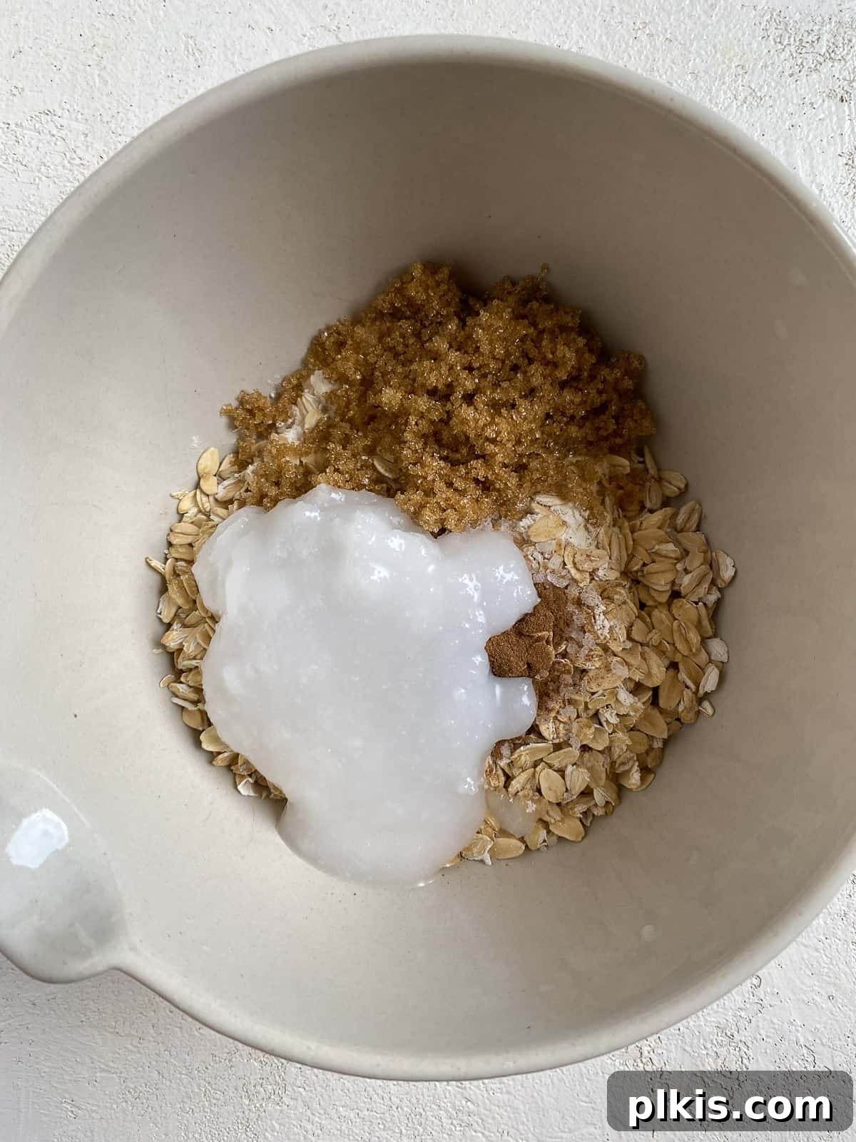 process of adding ingredients for filling in white bowl