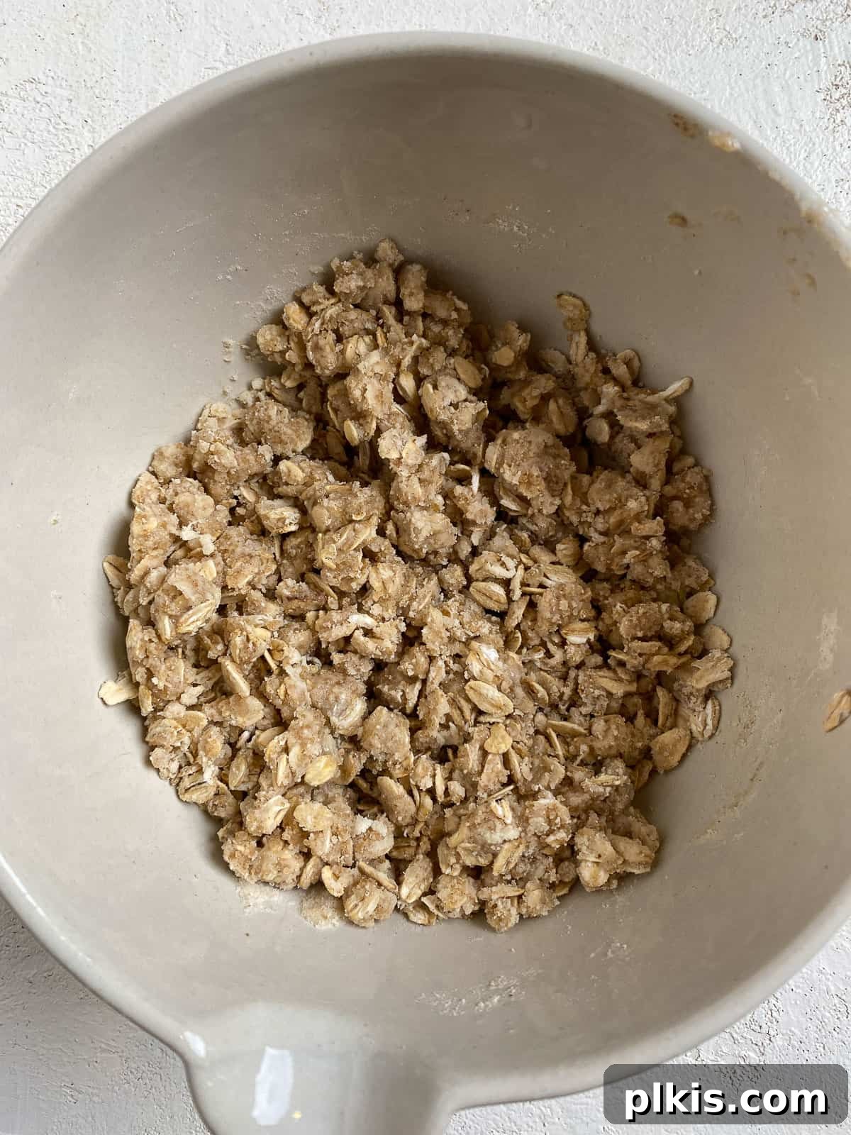 post mixing of peach crumb pie mixture in bowl