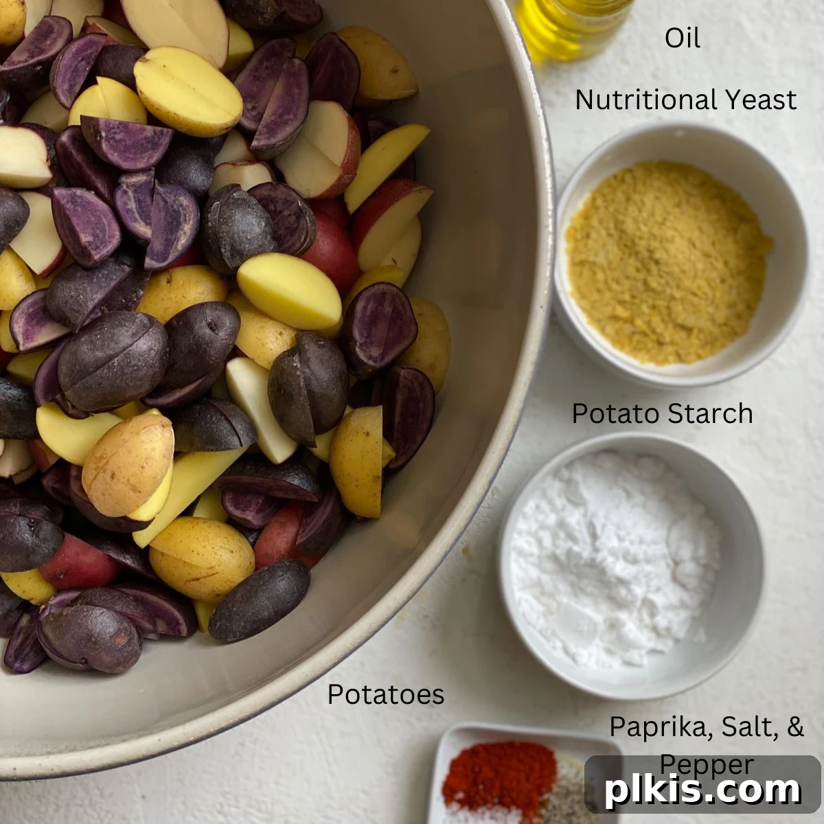 Crispy Purple Potato Perfection 3 ingredients for Crispy Purple Potatoes Recipe measured out against a white surface