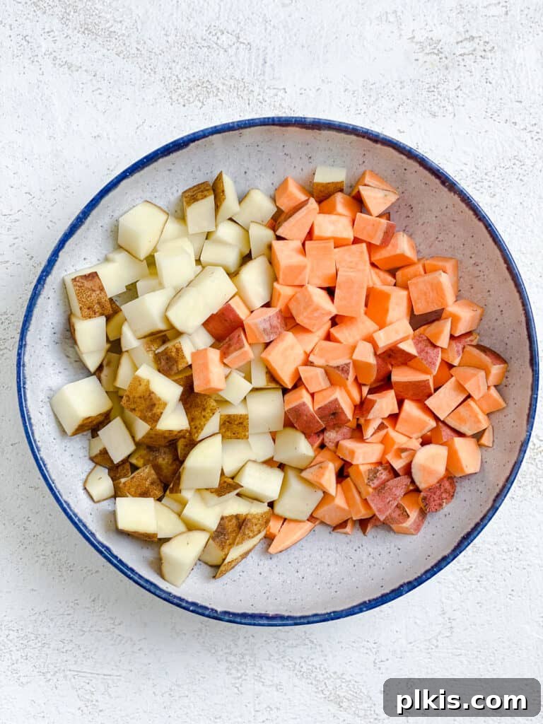 Comforting Red Lentil Stew 5 Diced potatoes in a bowl, prepared for the Hearty Red Lentil Stew.