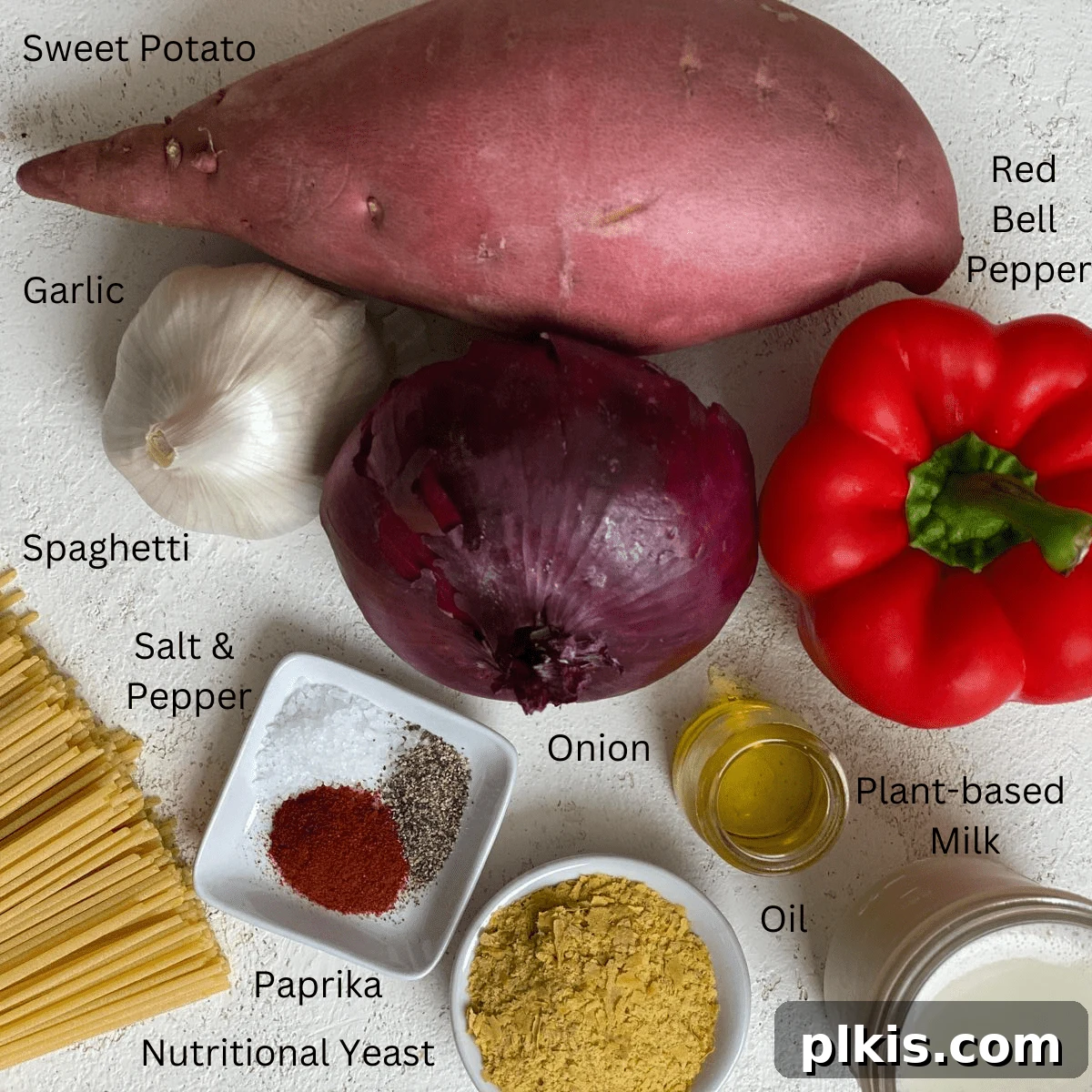 Velvety Sweet Potato Spaghetti 3 Ingredients for Sweet Potato Pasta Sauce with Spaghetti, neatly measured and arranged on a white surface