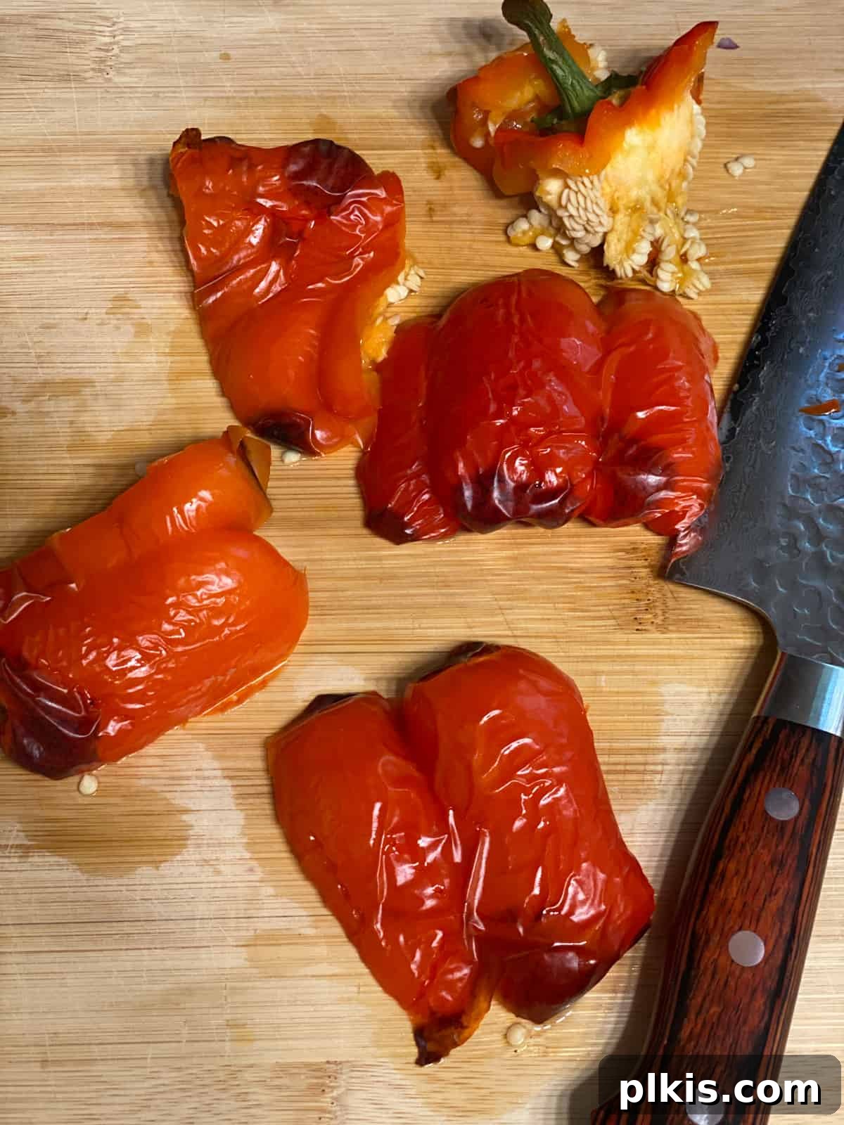 Velvety Sweet Potato Spaghetti 8 Sliced red pepper on a cutting board after being peeled and deseeded