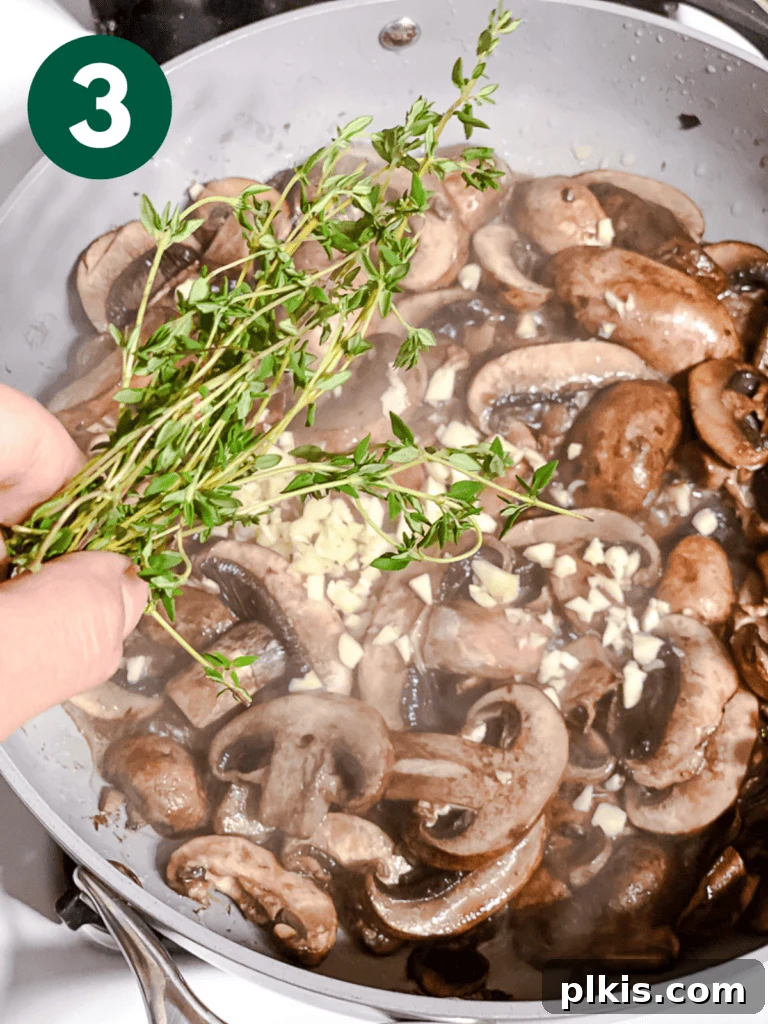 Sizzling Garlic Thyme Mushrooms 6 process shot of adding thyme to pan