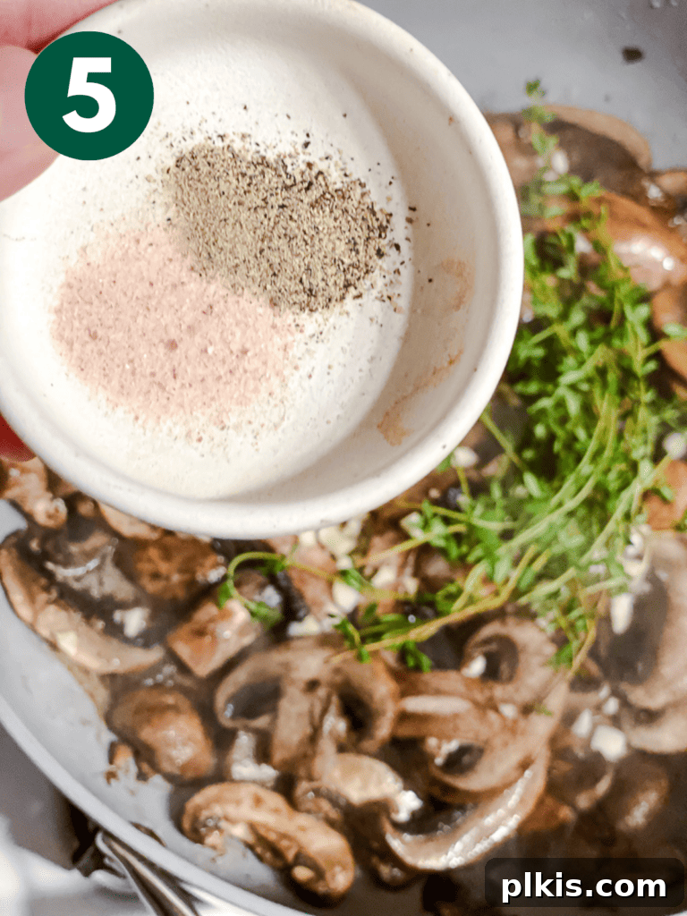 Sizzling Garlic Thyme Mushrooms 8 process shot of adding spices to pan