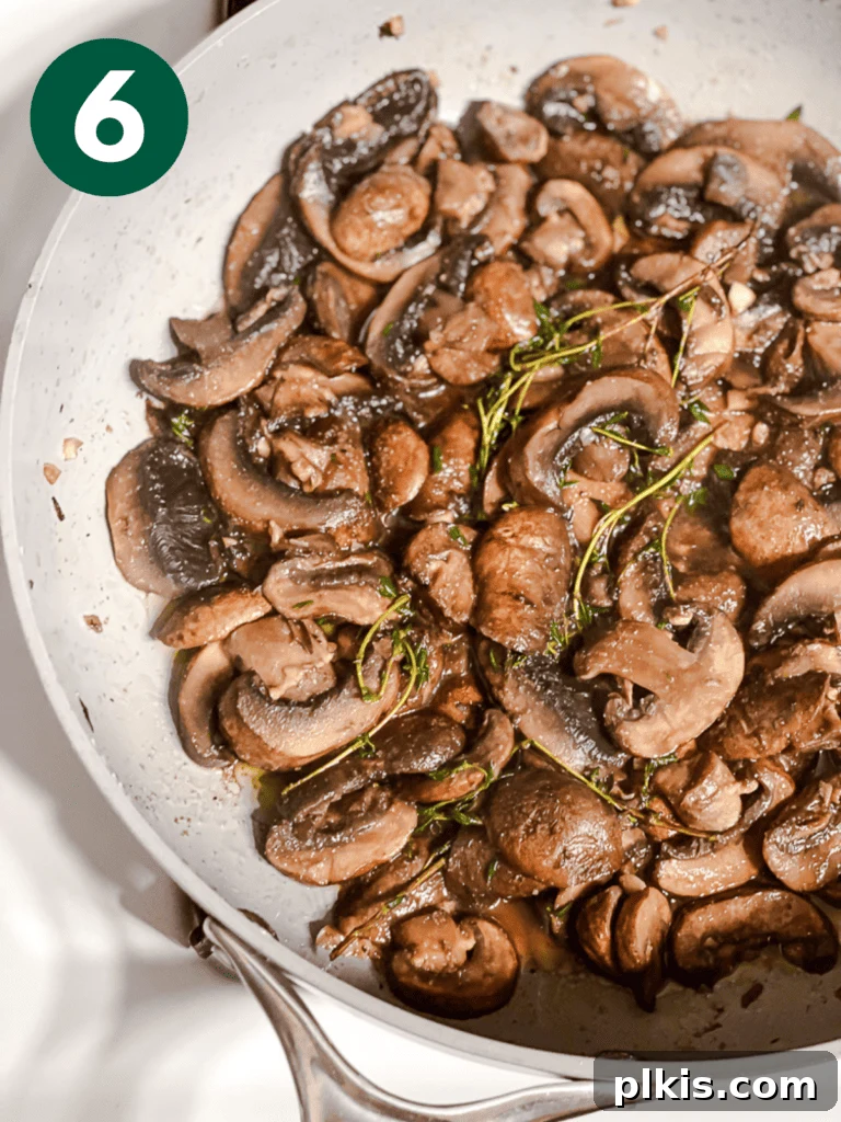 Sizzling Garlic Thyme Mushrooms 9 process shot of cooking mushrooms in pan