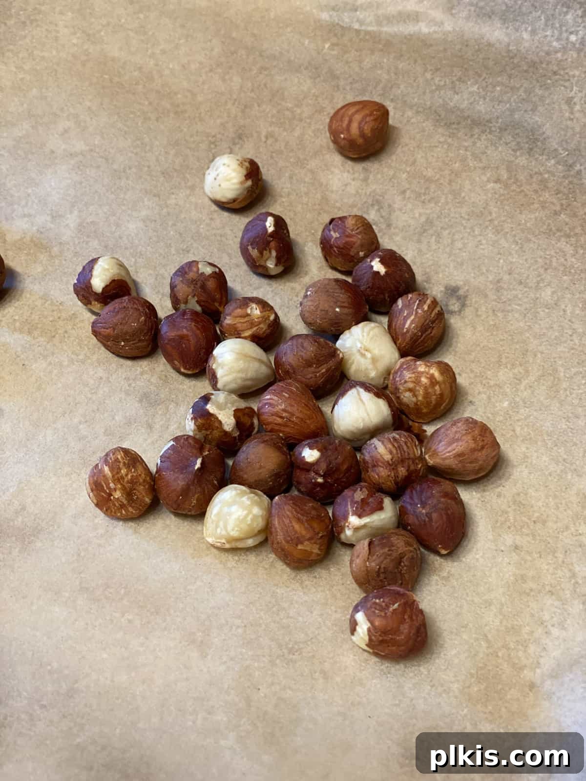 Golden Roasted Delicata Sweet Potato Soup 11 Hazelnuts scattered on parchment paper before toasting