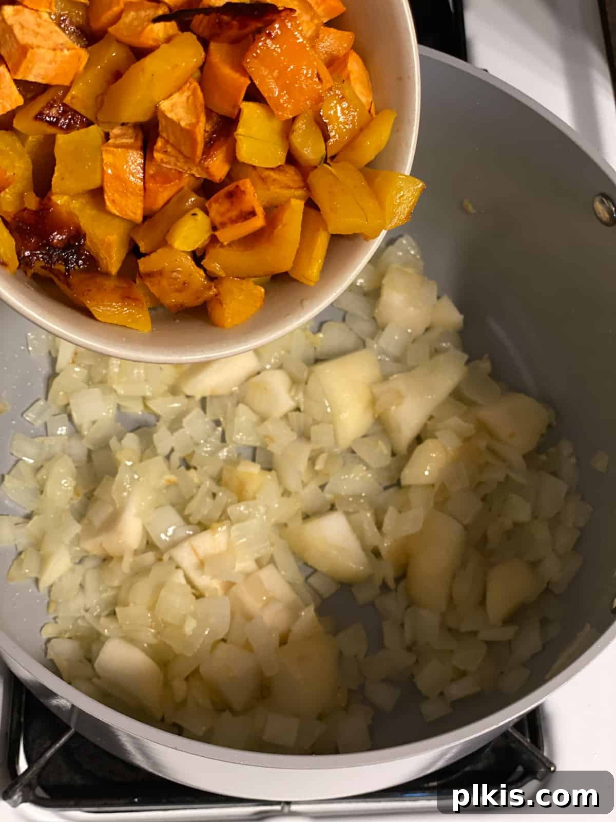 Golden Roasted Delicata Sweet Potato Soup 8 Process shot of adding roasted sweet potato to the pan