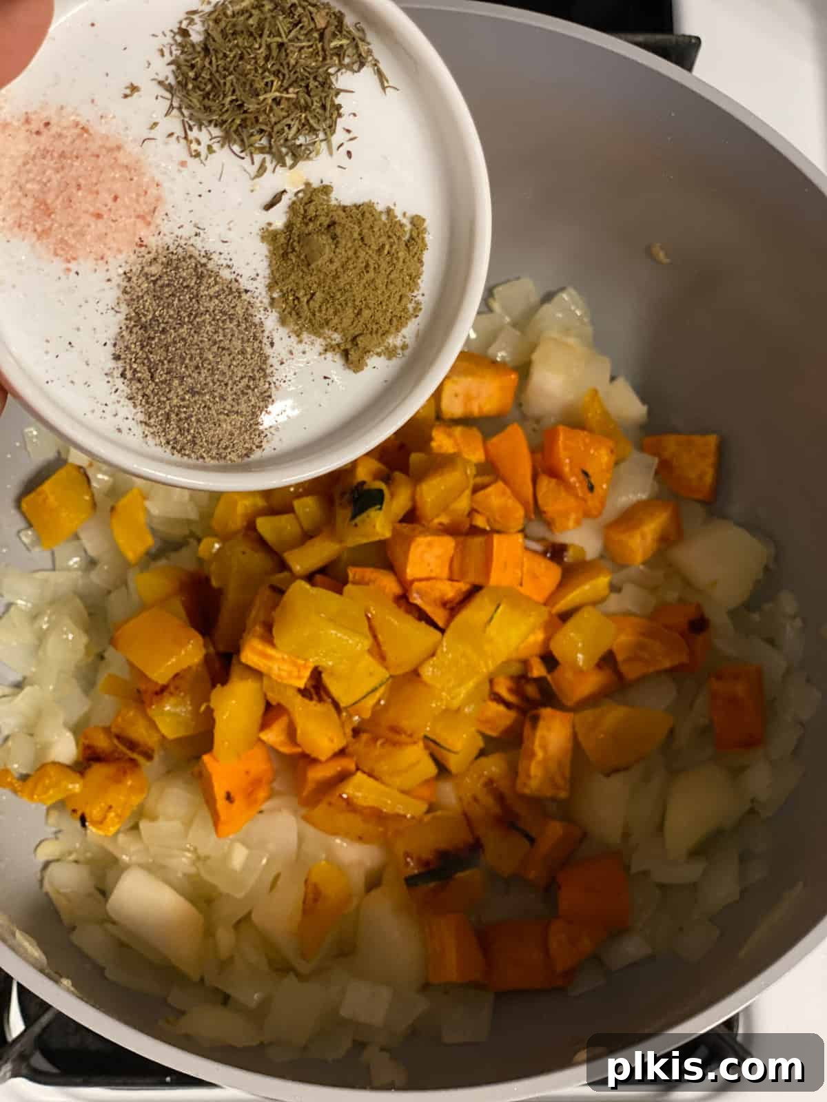 Golden Roasted Delicata Sweet Potato Soup 9 Process shot of adding roasted squash to the pan