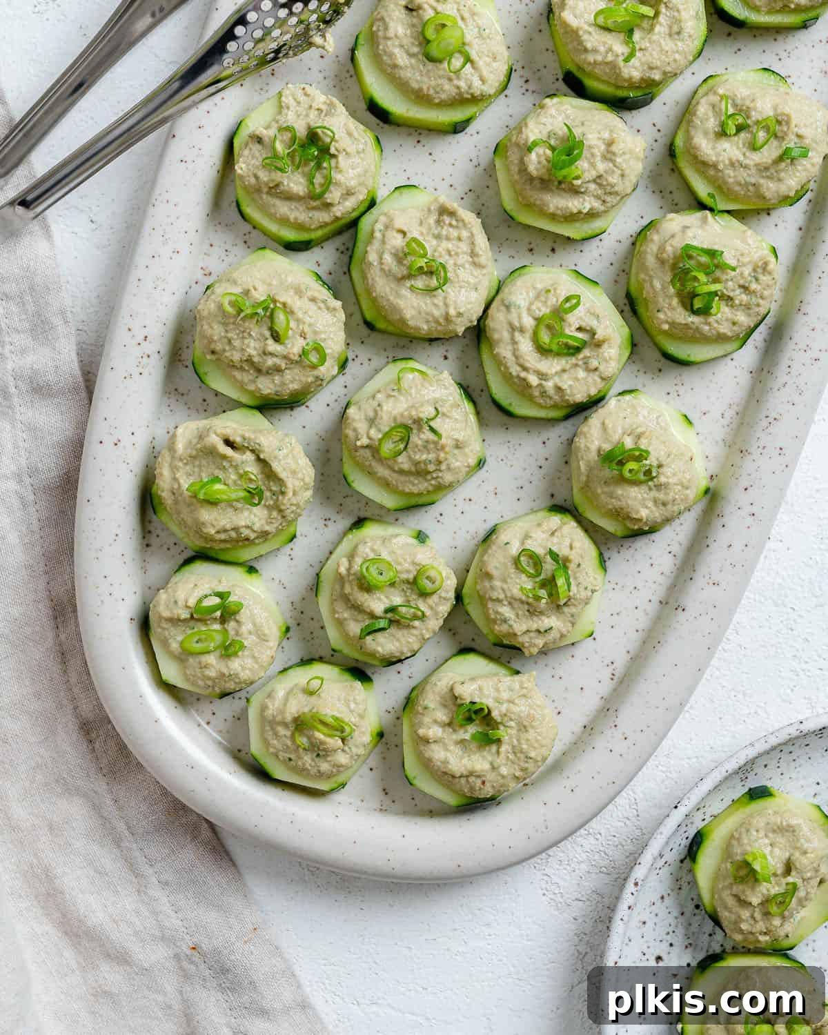 Refreshing Cucumber & Chive Sunflower Cream Bites 2 Completed Easy Cucumber Bites with Sunflower Chive Cream Cheese on a serving platter. Fresh, vibrant, and ready to serve as a healthy vegan appetizer.