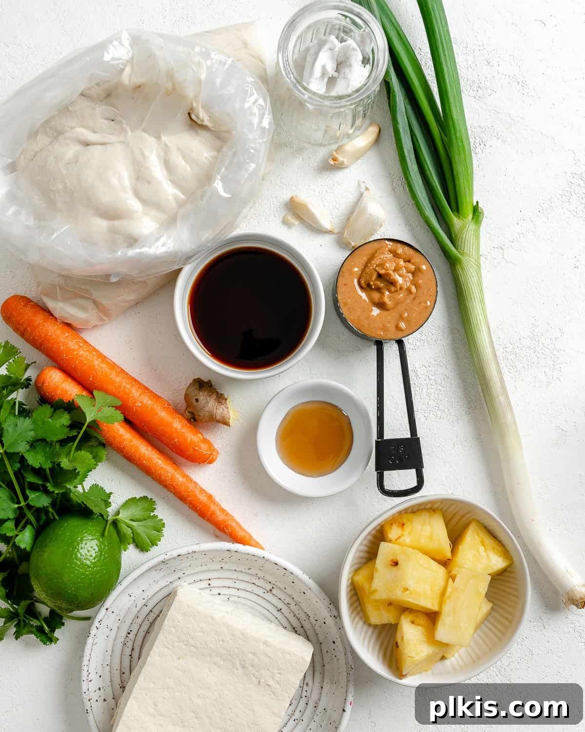 Irresistible Vegan Thai Pizza 3 ingredients for Thai pizza measured out against a white surface
