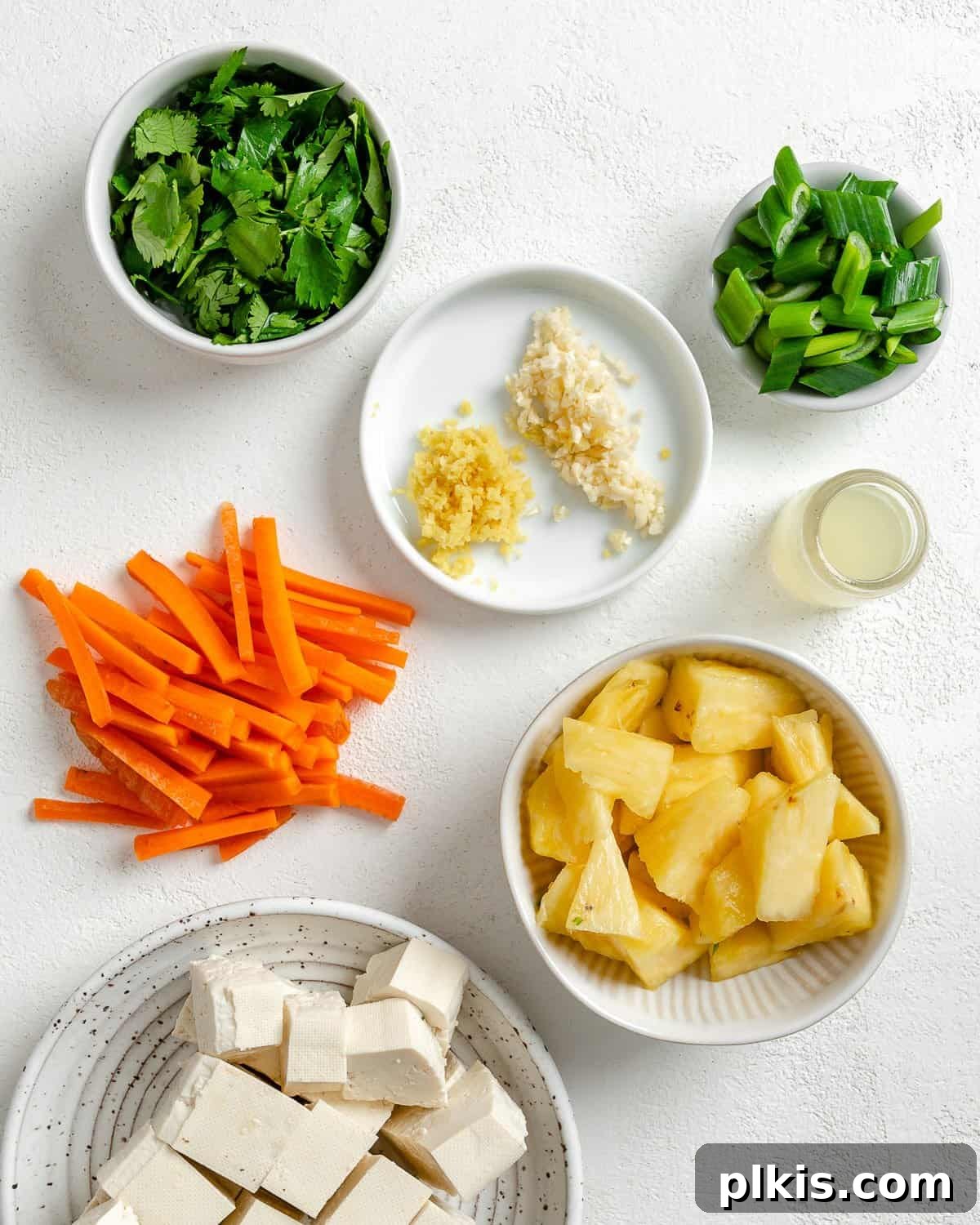 Irresistible Vegan Thai Pizza 7 ingredients for Thai pizza measured out against a white surface