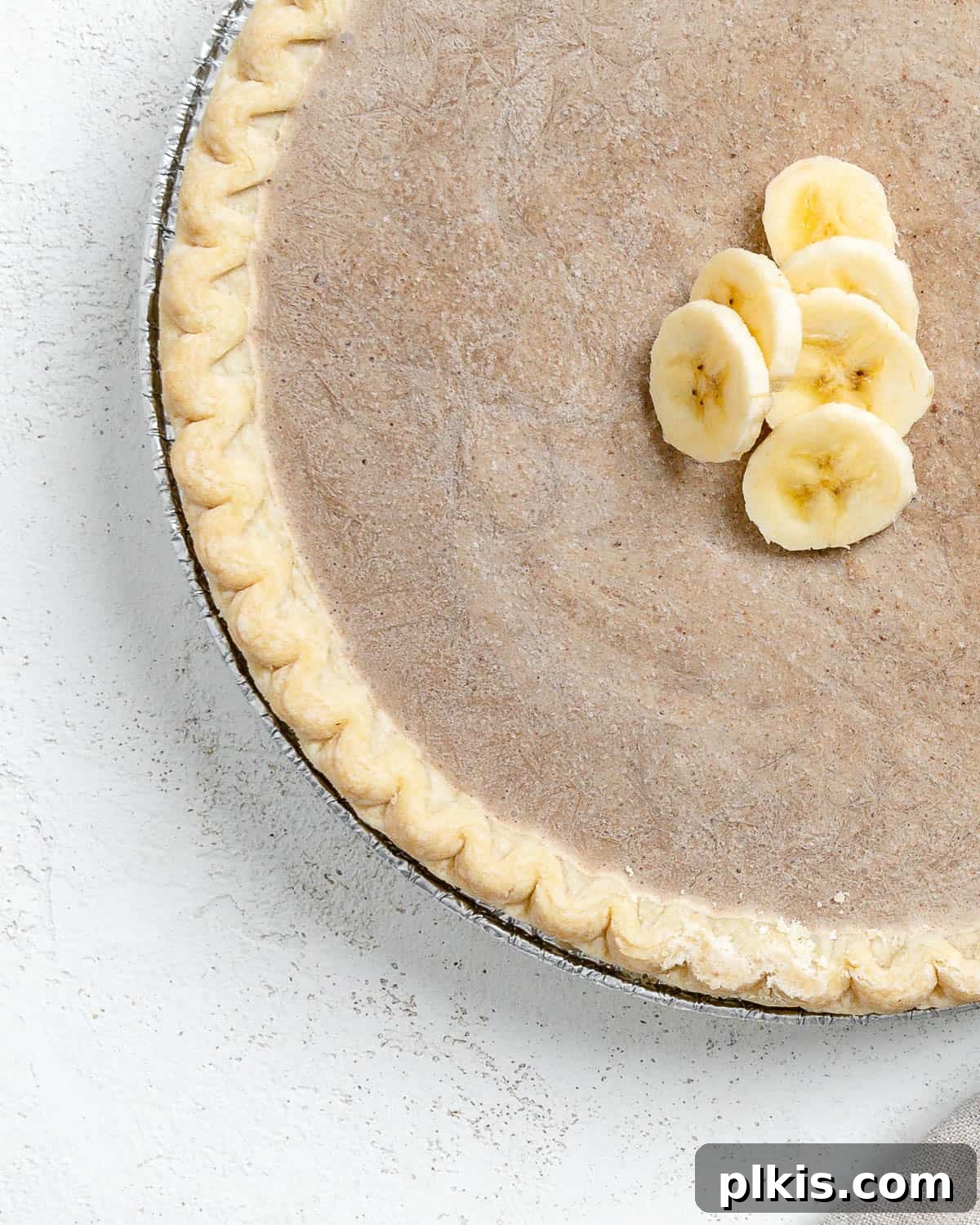 Velvet Vegan Banana Cream Pie 2 completed Vegan Banana Cream Pie against a light surface