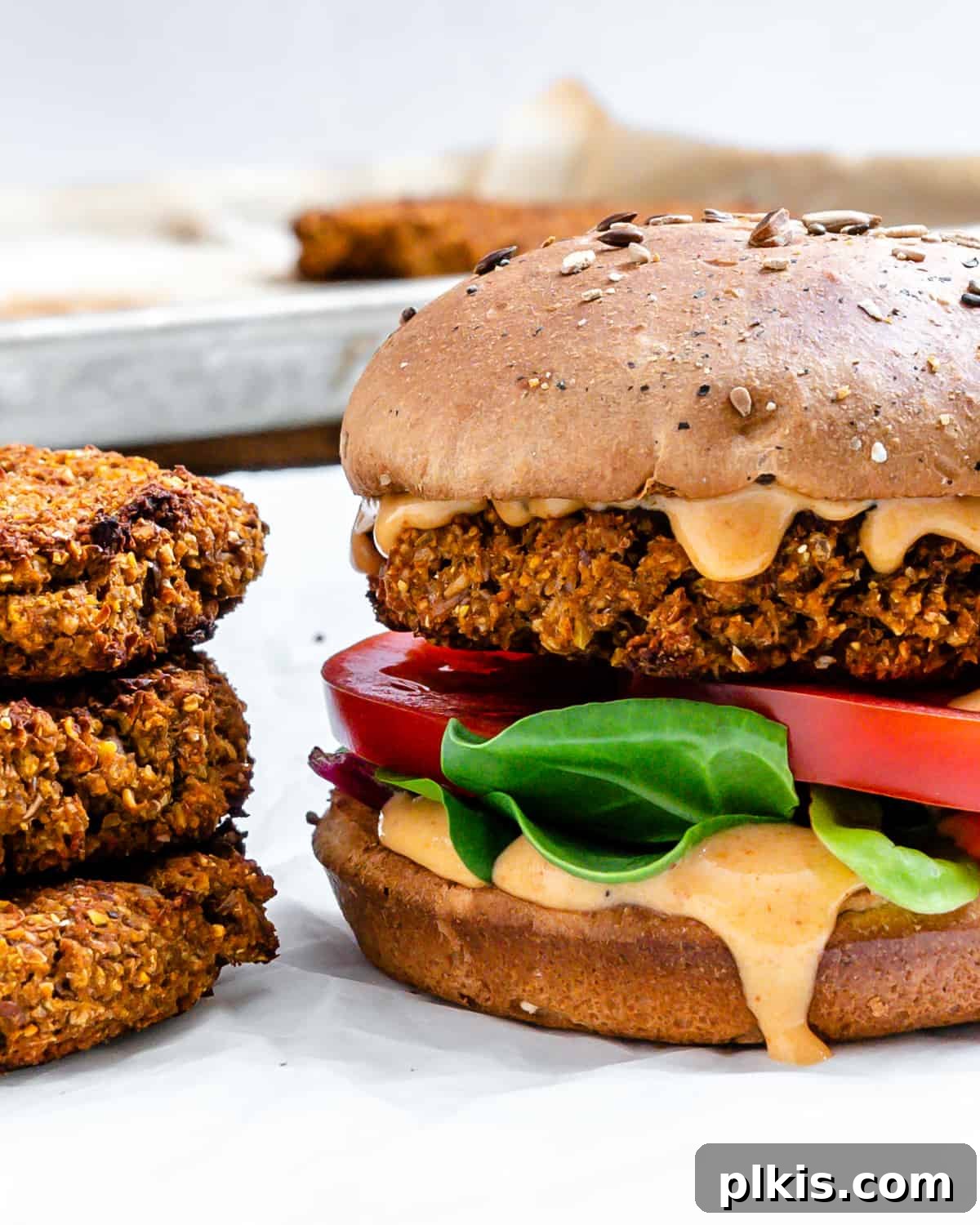 Ultimate Vegan Lentil Burgers 18 A plate of completed The Best Vegan Lentil Burgers, garnished and ready to eat.