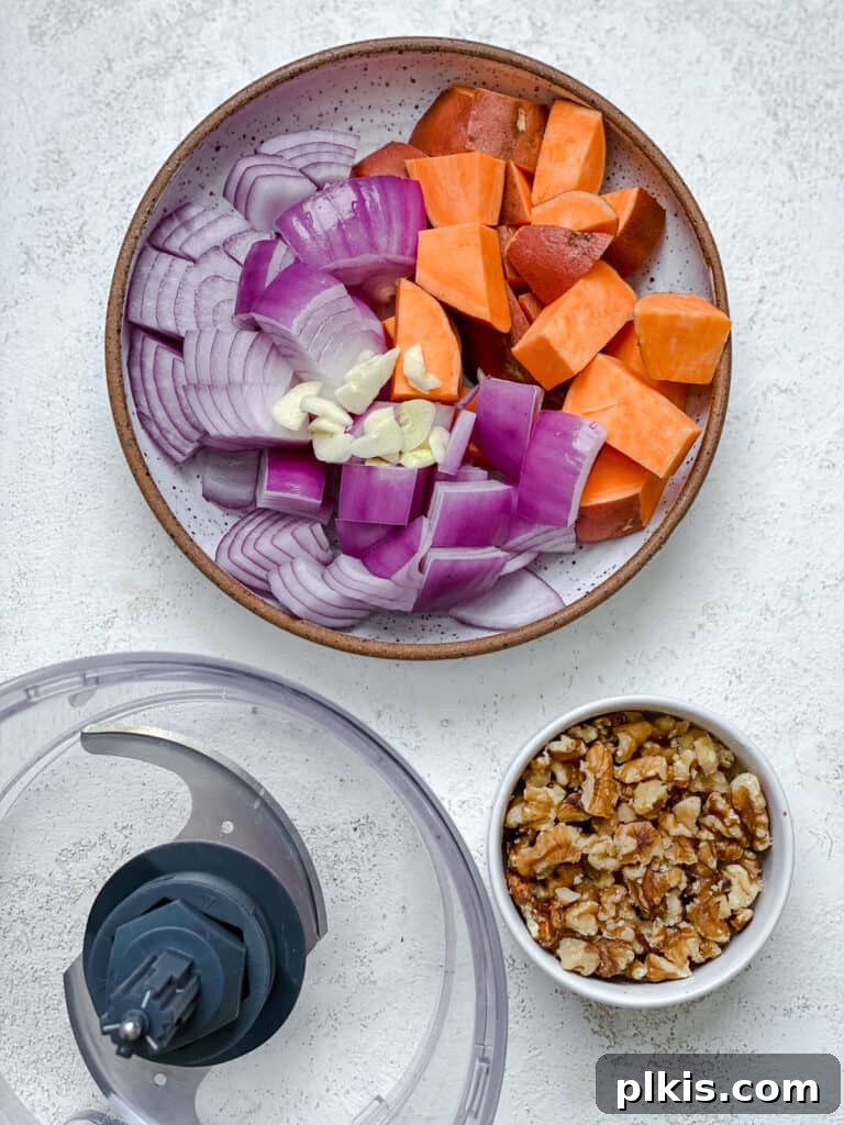 Ultimate Vegan Lentil Burgers 5 Ingredients for The Best Vegan Lentil Burgers measured out on a white surface alongside a food processor.